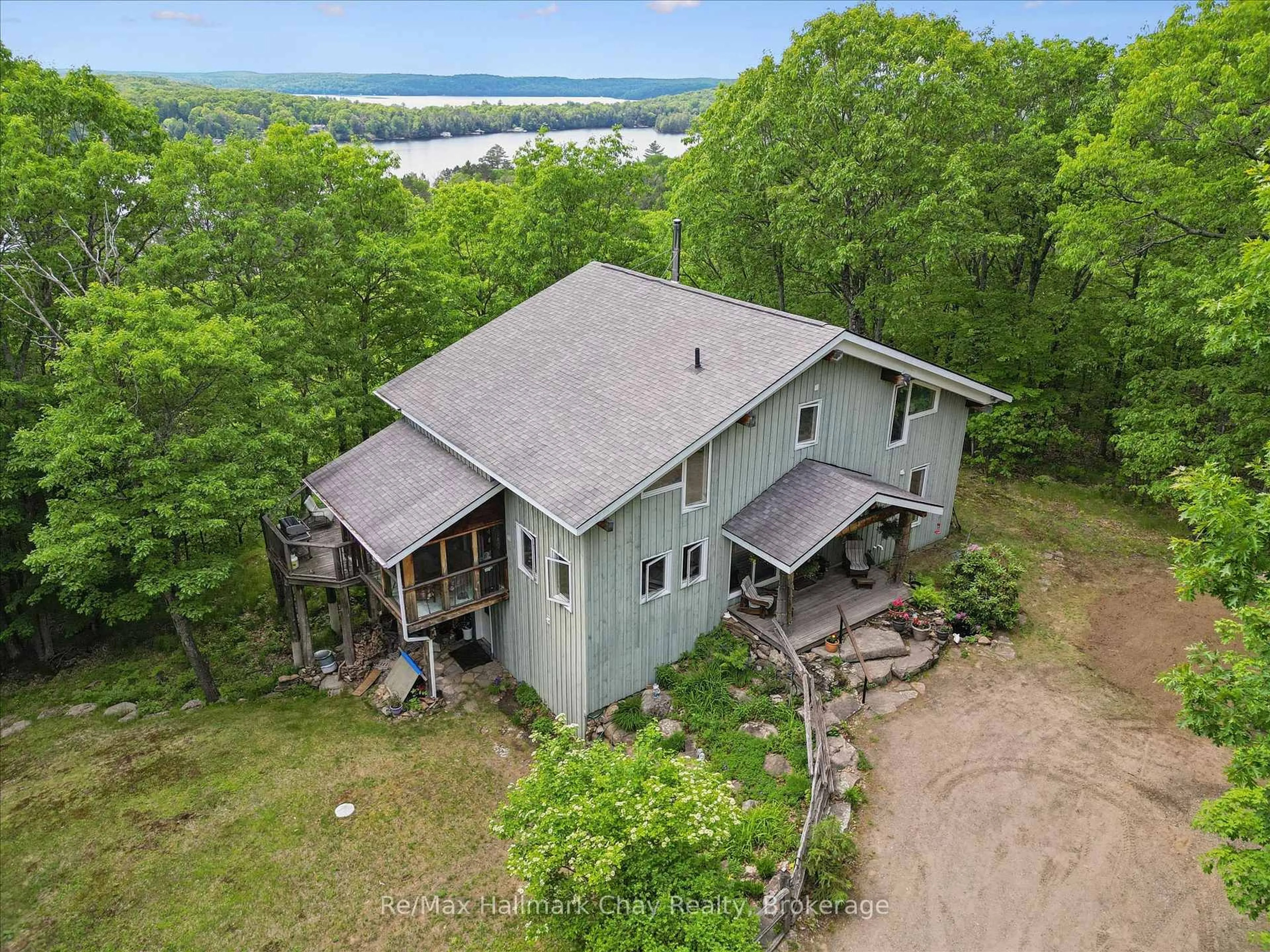 A pic from outside/outdoor area/front of a property/back of a property/a pic from drone, water/lake/river/ocean view for 1497 Fox Point Rd, Lake of Bays Ontario P0A 1H0