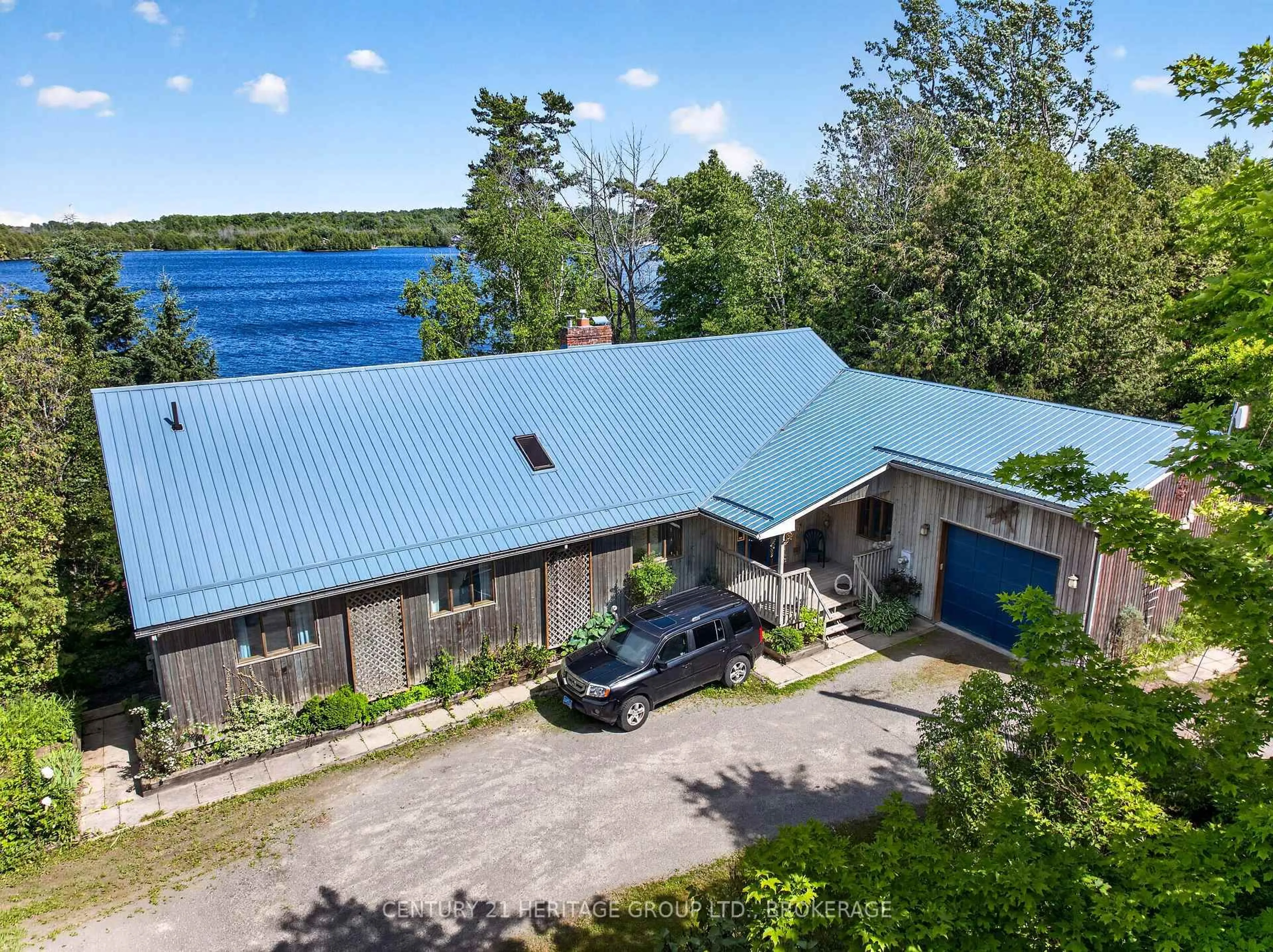A pic from outside/outdoor area/front of a property/back of a property/a pic from drone, water/lake/river/ocean view for 338 Neville Point Rd, Stone Mills Ontario K0K 2A0