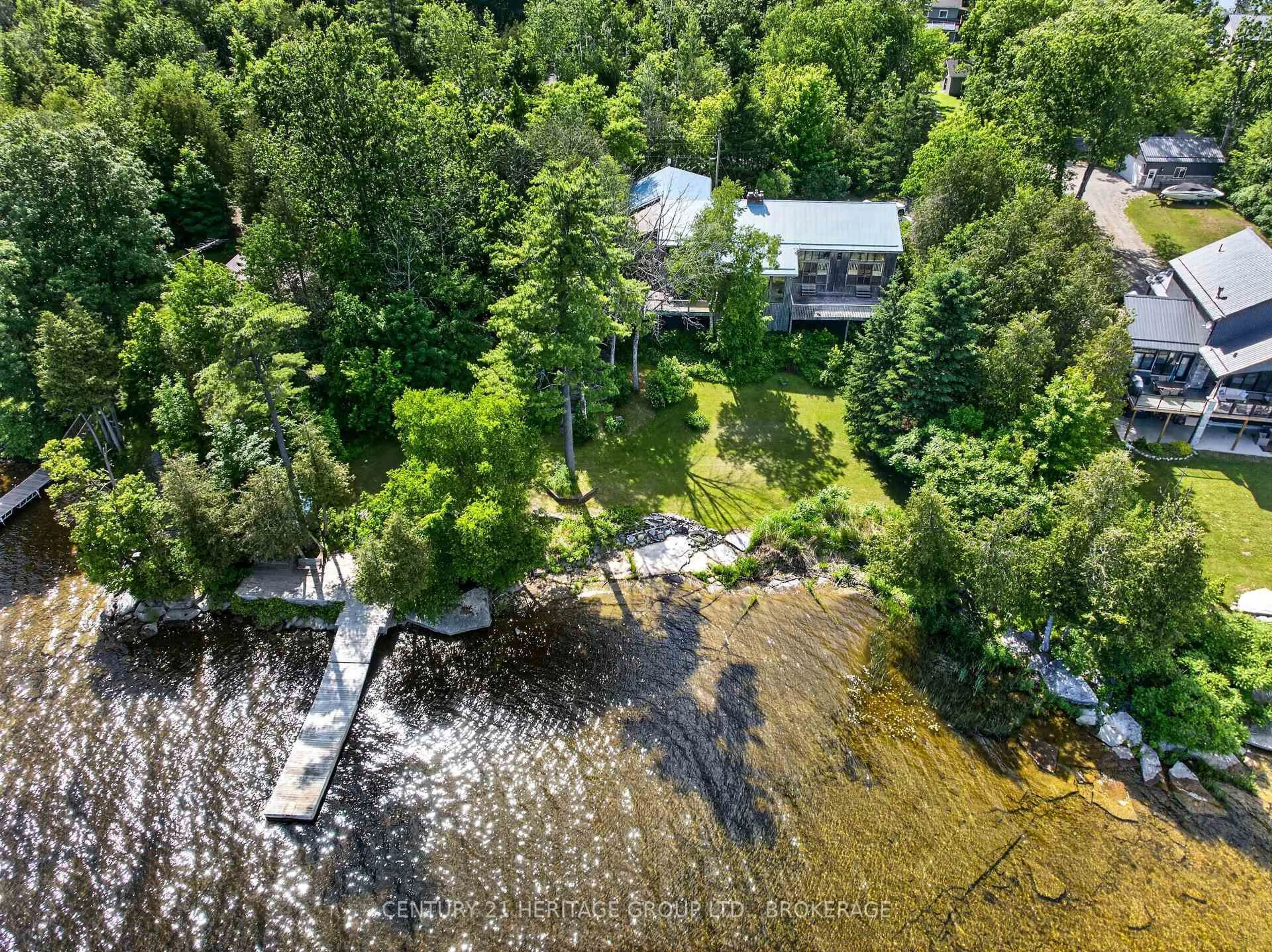 A pic from outside/outdoor area/front of a property/back of a property/a pic from drone, water/lake/river/ocean view for 338 Neville Point Rd, Stone Mills Ontario K0K 2A0