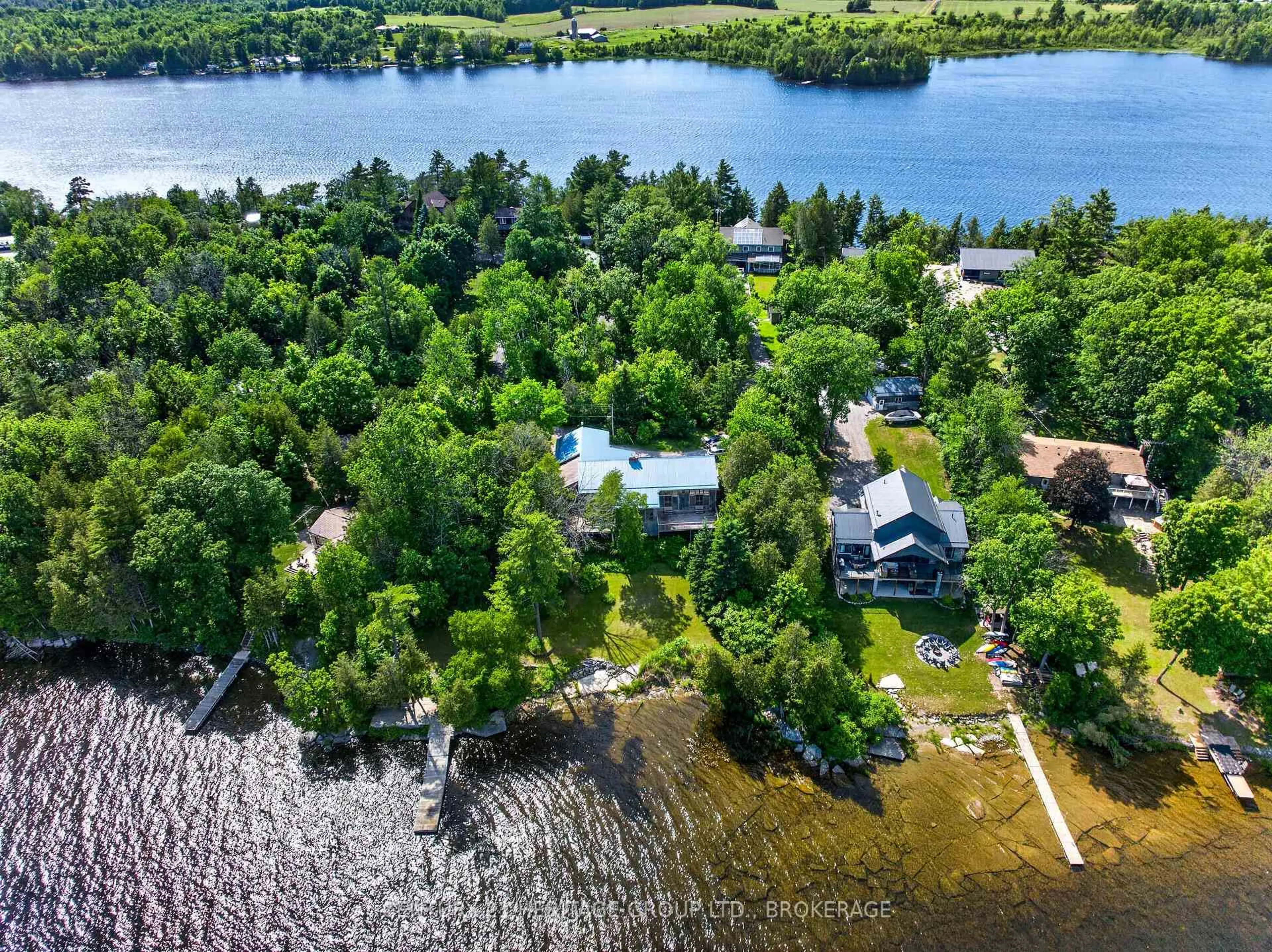 A pic from outside/outdoor area/front of a property/back of a property/a pic from drone, water/lake/river/ocean view for 338 Neville Point Rd, Stone Mills Ontario K0K 2A0