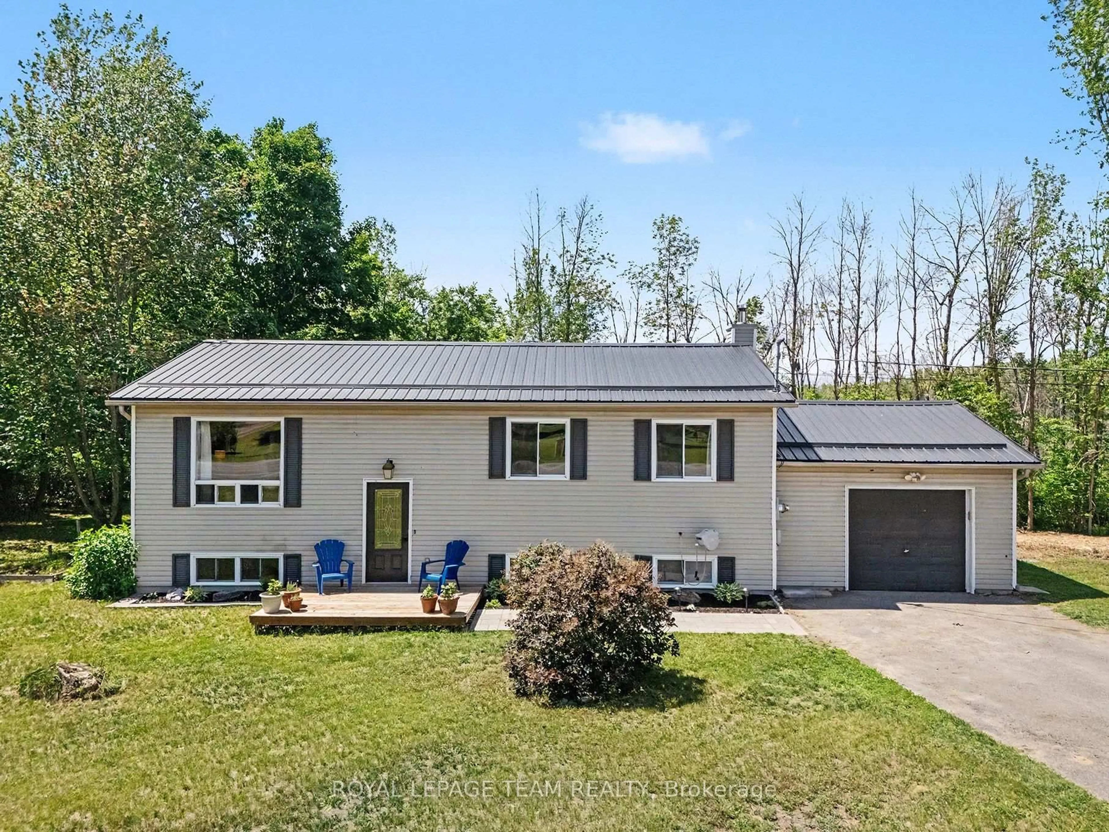 Home with vinyl exterior material, street for 2495 River Rd, North Grenville Ontario K0G 1J0