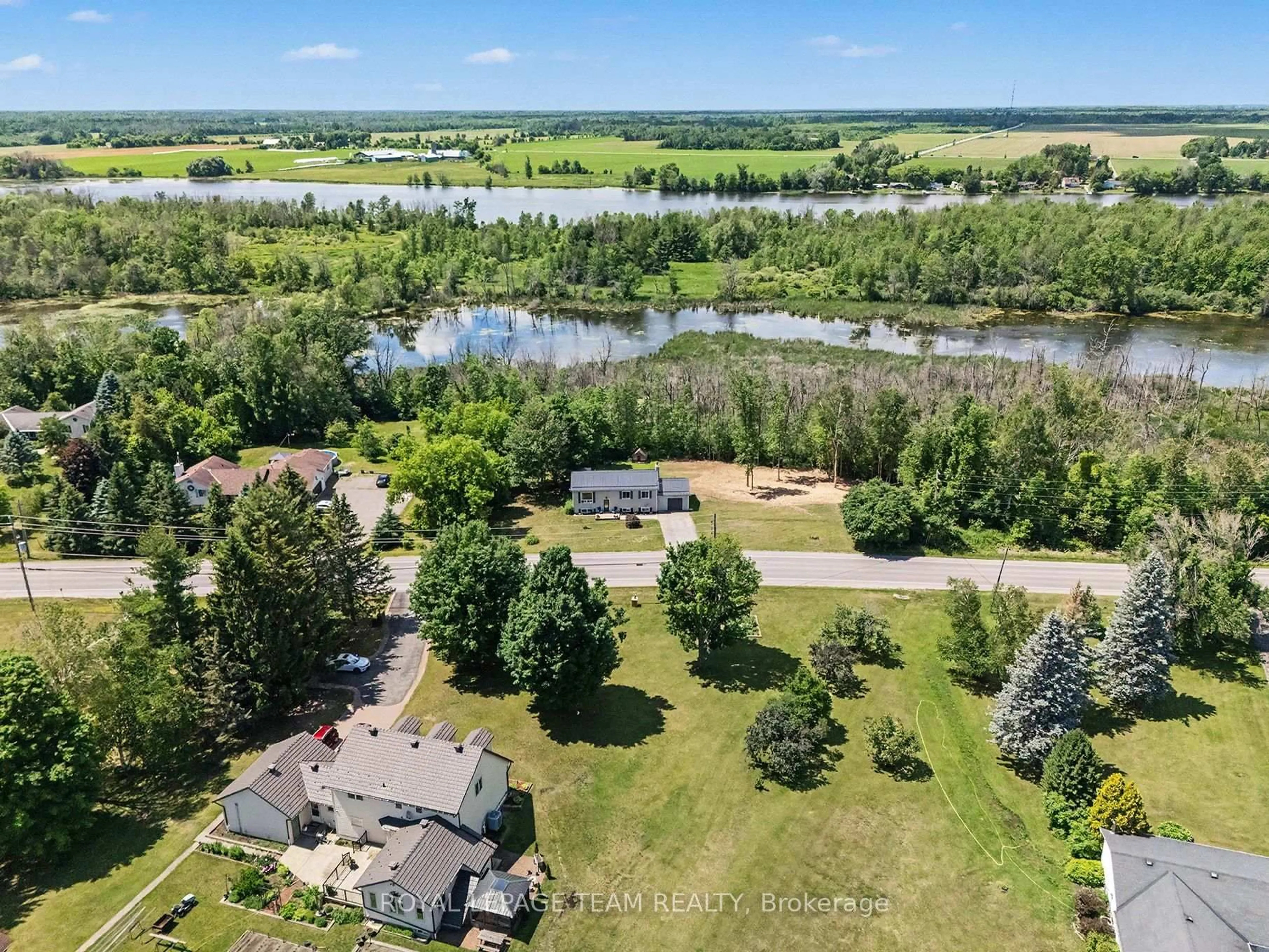 A pic from outside/outdoor area/front of a property/back of a property/a pic from drone, water/lake/river/ocean view for 2495 River Rd, North Grenville Ontario K0G 1J0