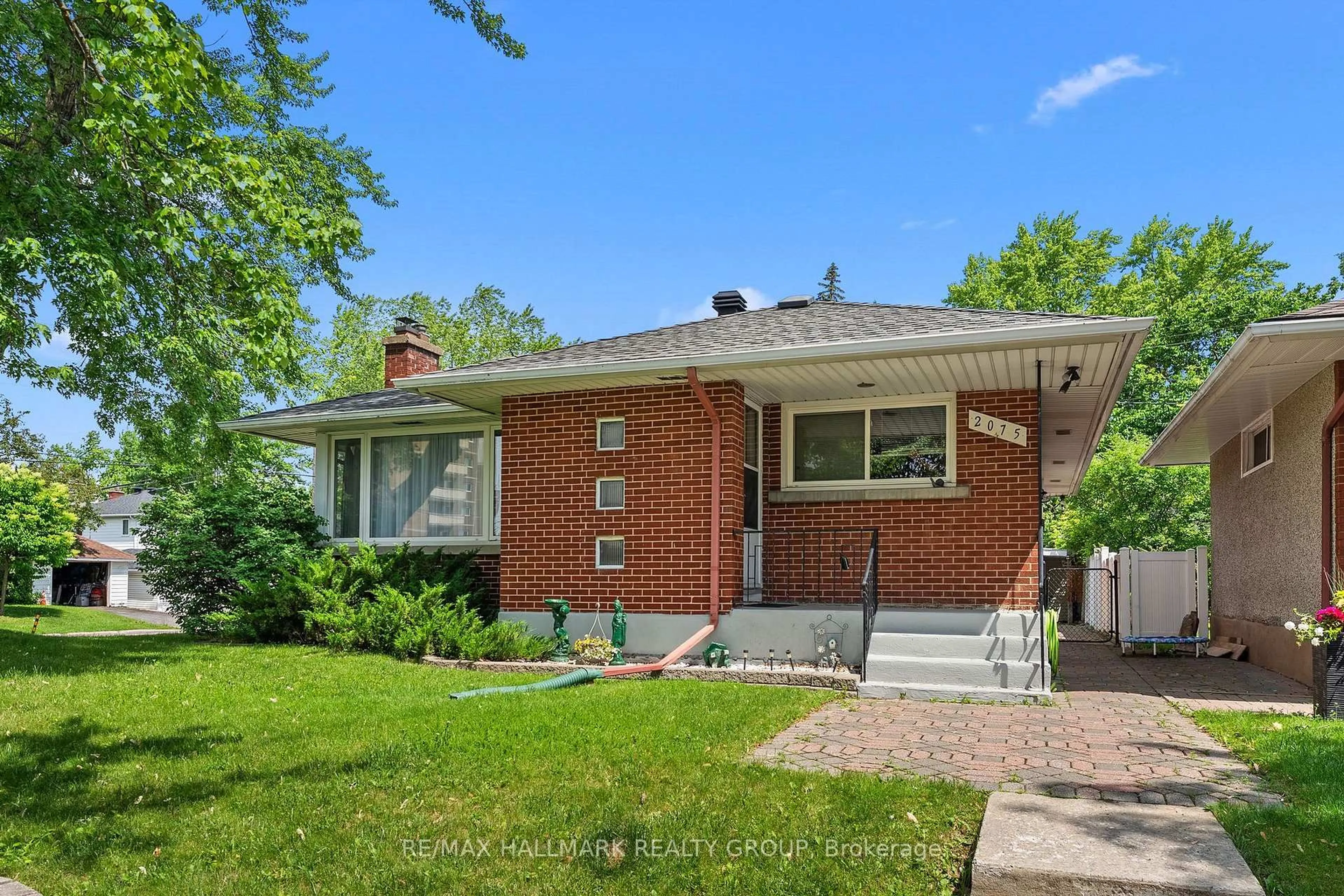 Home with brick exterior material, street for 2075 Neepawa Ave, Ottawa Ontario K2A 3L7