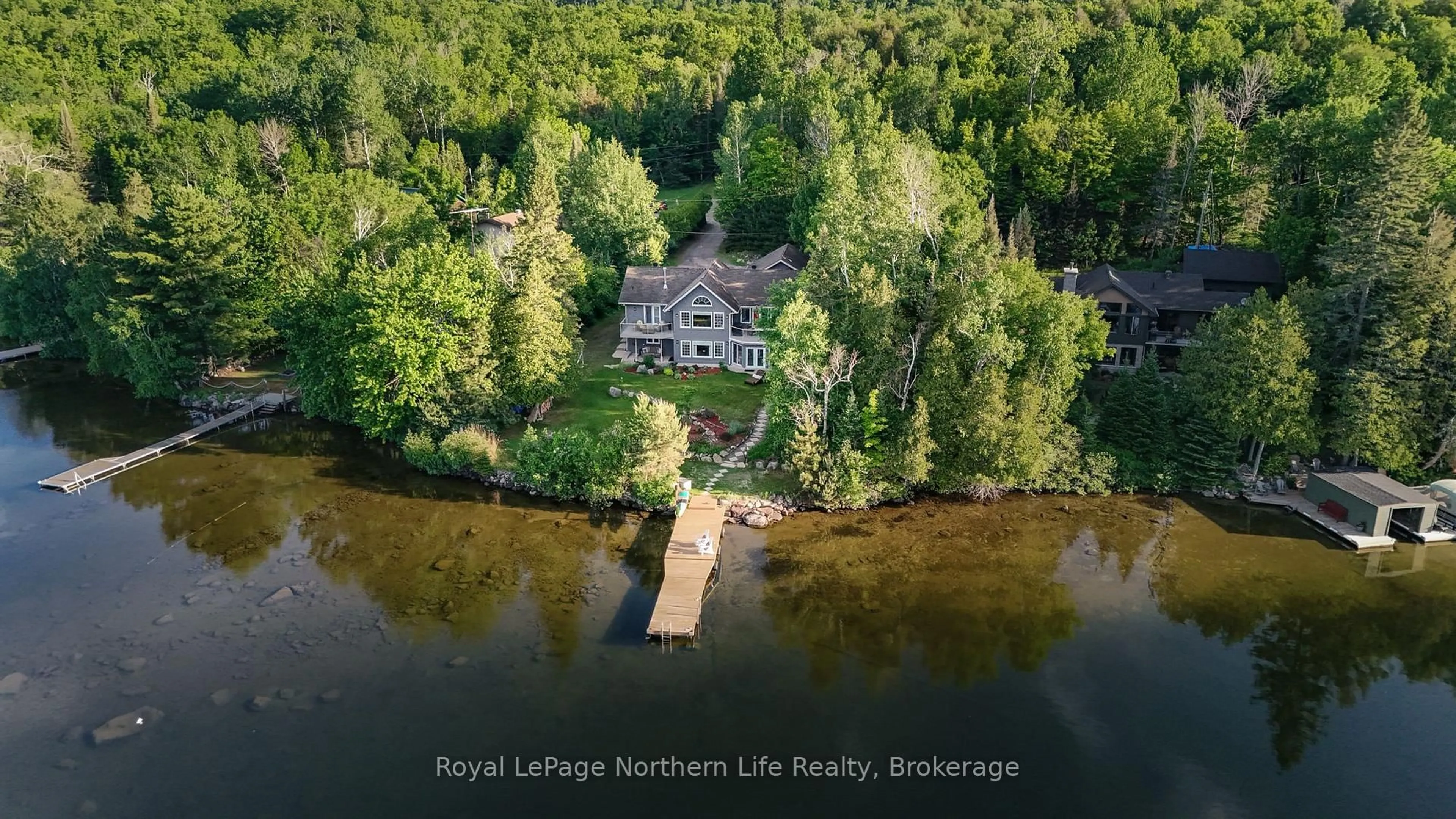 A pic from outside/outdoor area/front of a property/back of a property/a pic from drone, water/lake/river/ocean view for 571 D REGAL Rd, North Bay Ontario P1B 8G4