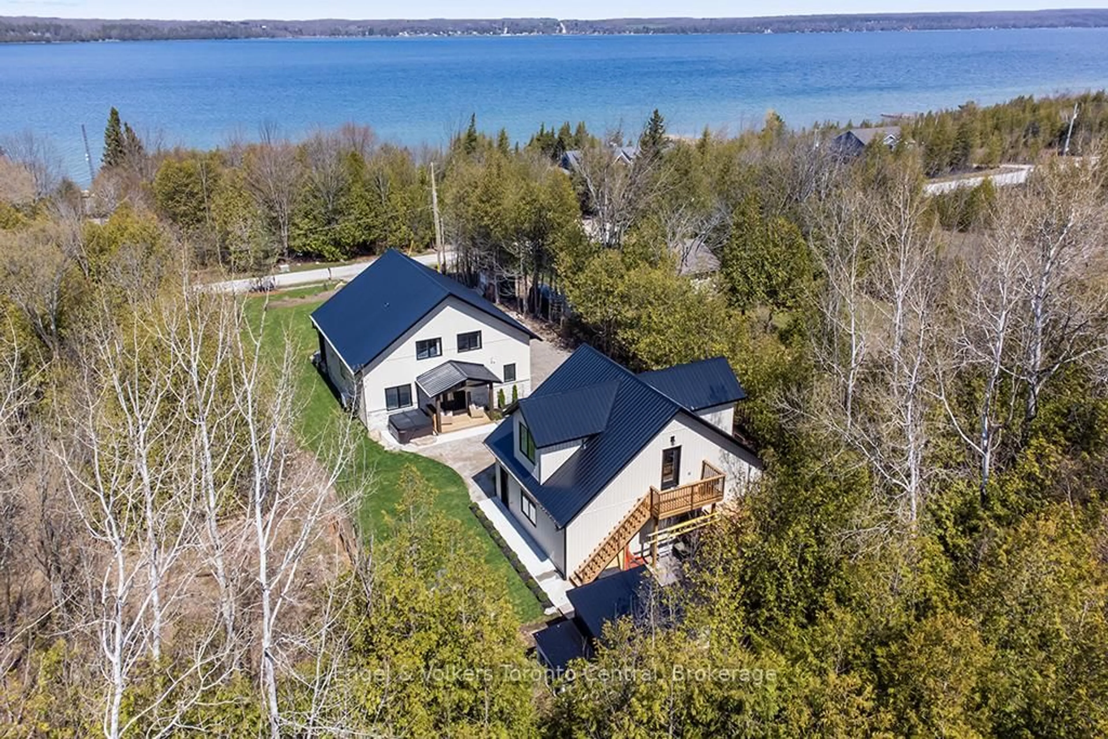 A pic from outside/outdoor area/front of a property/back of a property/a pic from drone, water/lake/river/ocean view for 138 Wilson Dr, Georgian Bluffs Ontario N0H 2T0