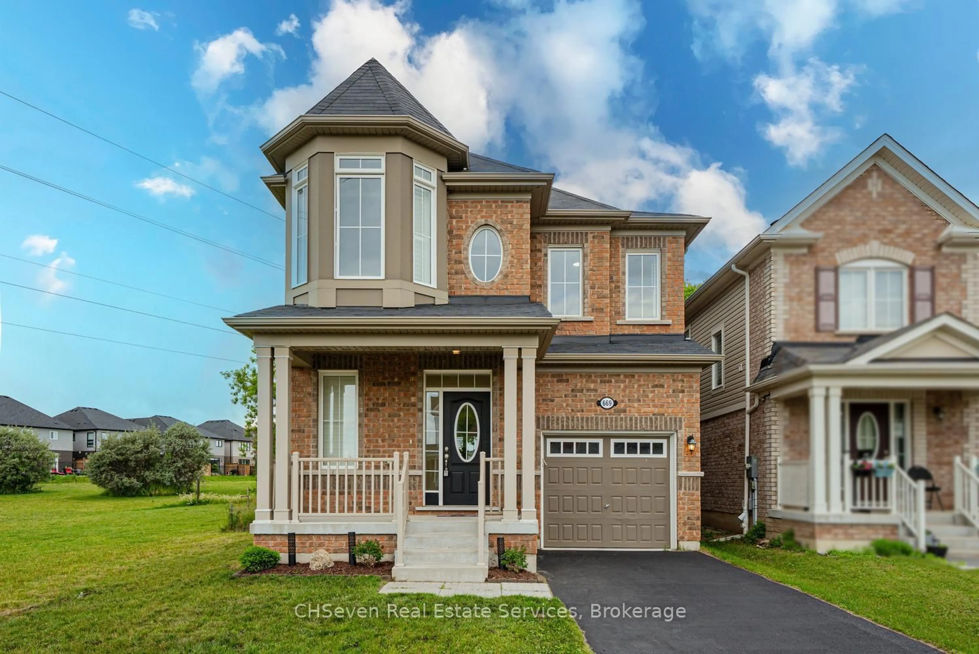 Home with brick exterior material, street for 669 Doon South Dr, Kitchener Ontario N2P 0H5