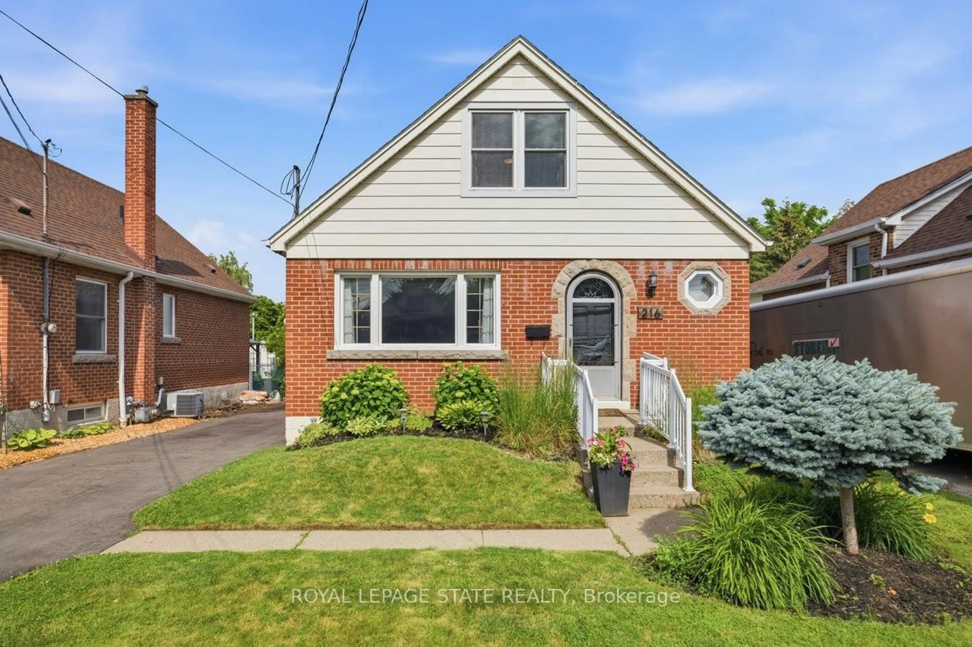Home with brick exterior material, street for 216 Summerhill Ave, Hamilton Ontario L8K 3N7