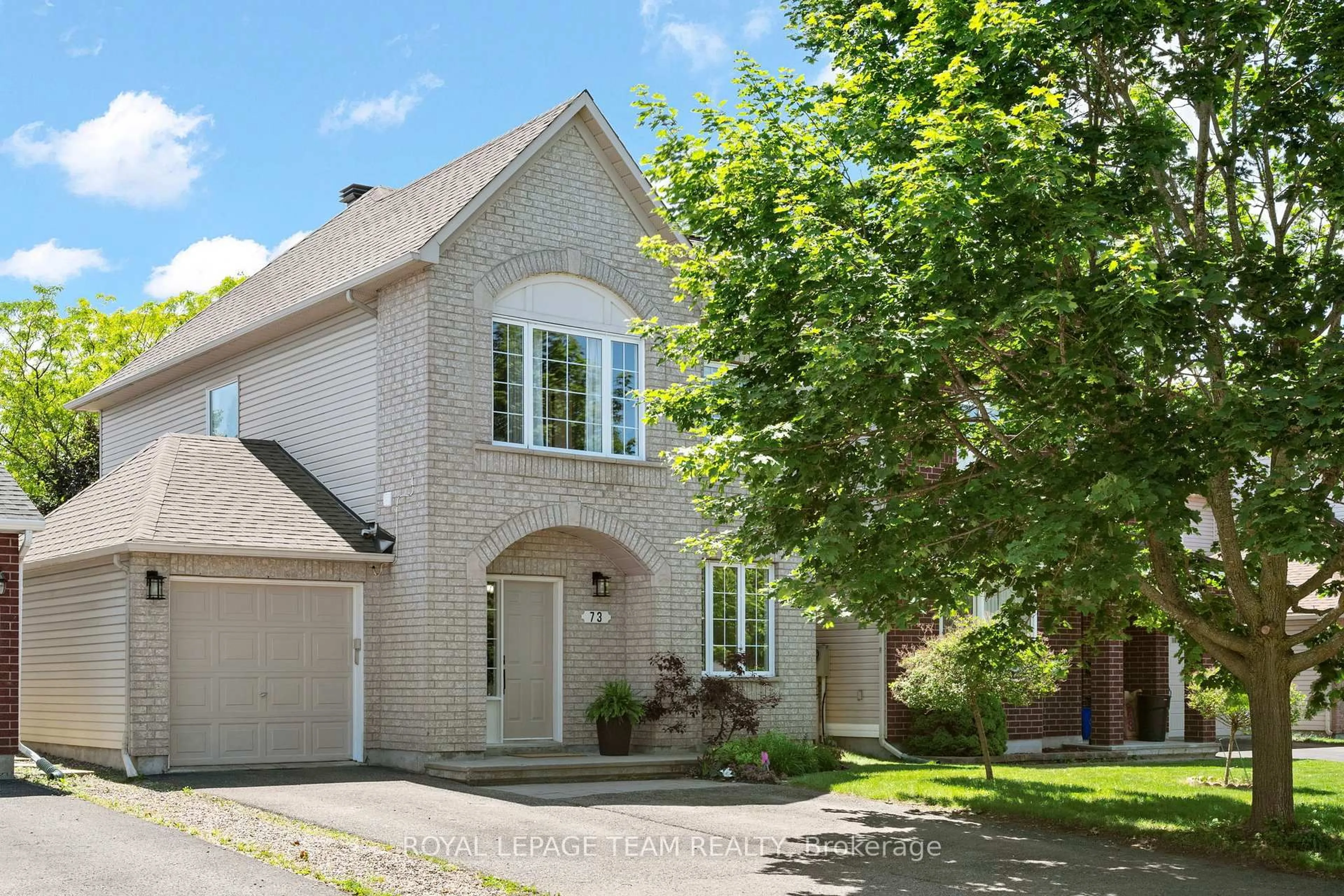 Home with brick exterior material, street for 73 Deerfox Dr, Ottawa Ontario K2J 4V1