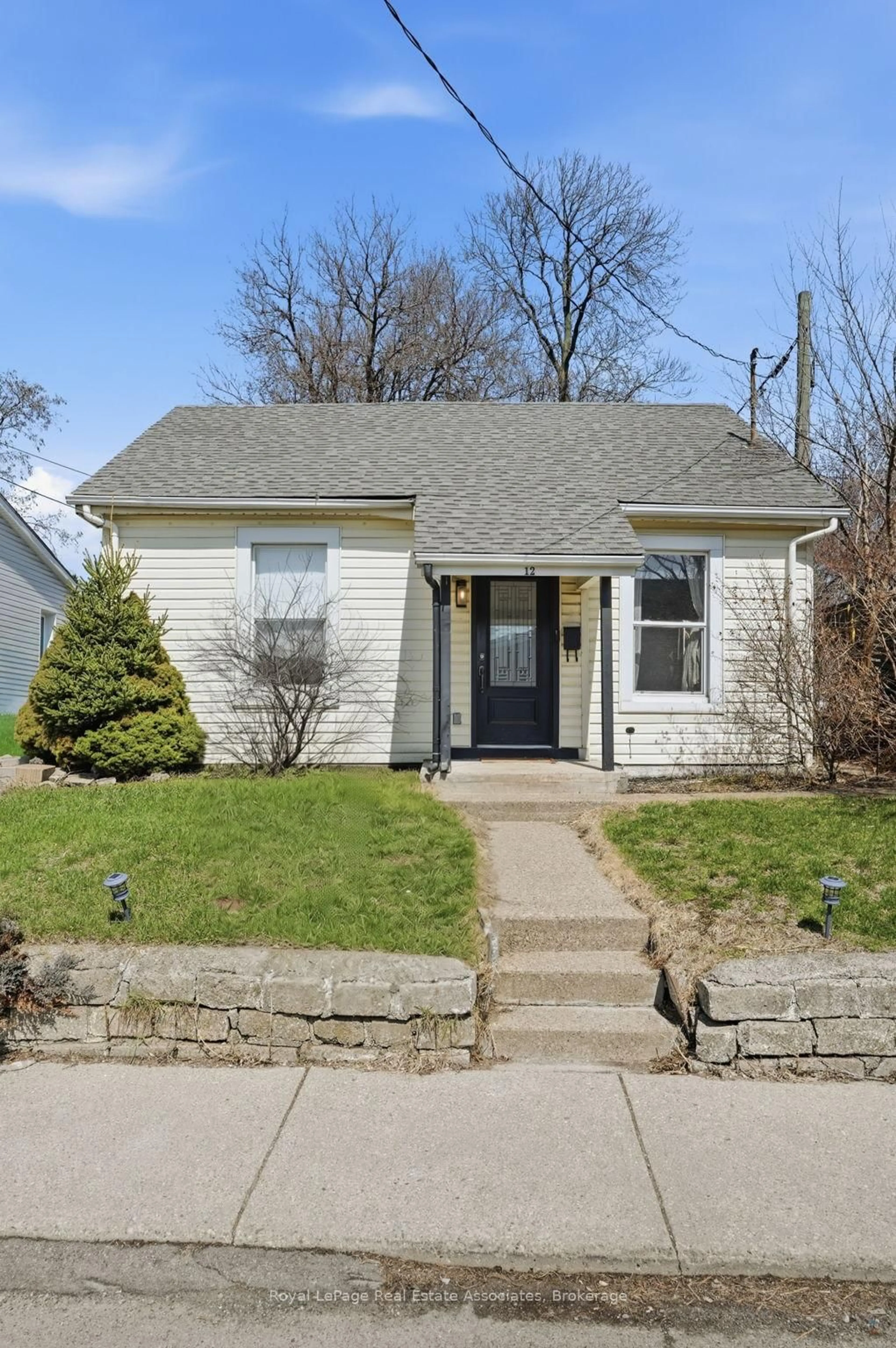 Home with vinyl exterior material, street for 12 Nelson St, Hamilton Ontario L8P 1G3