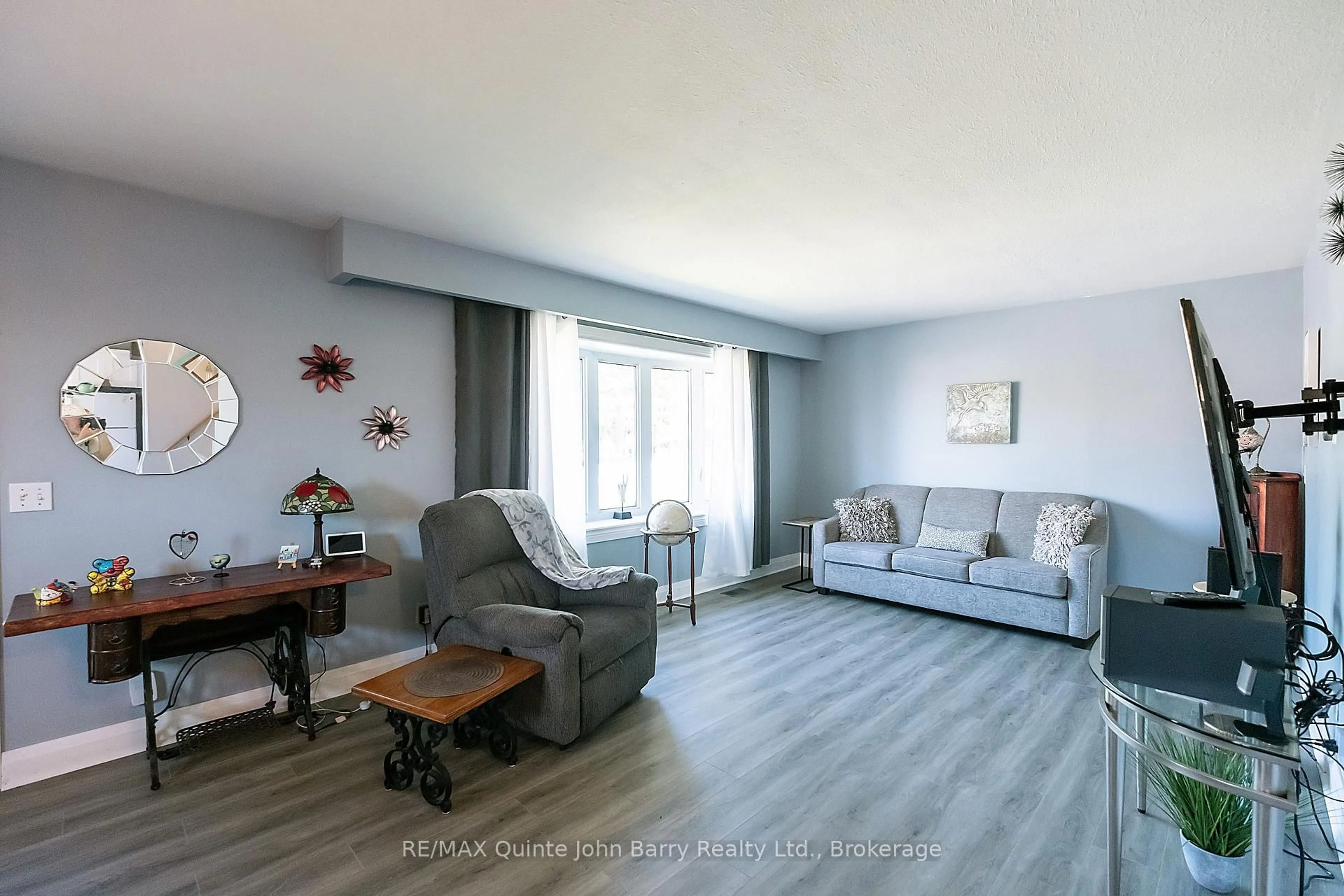 Living room with furniture, wood/laminate floor for 91 Scott St, Quinte West Ontario K8V 3B5