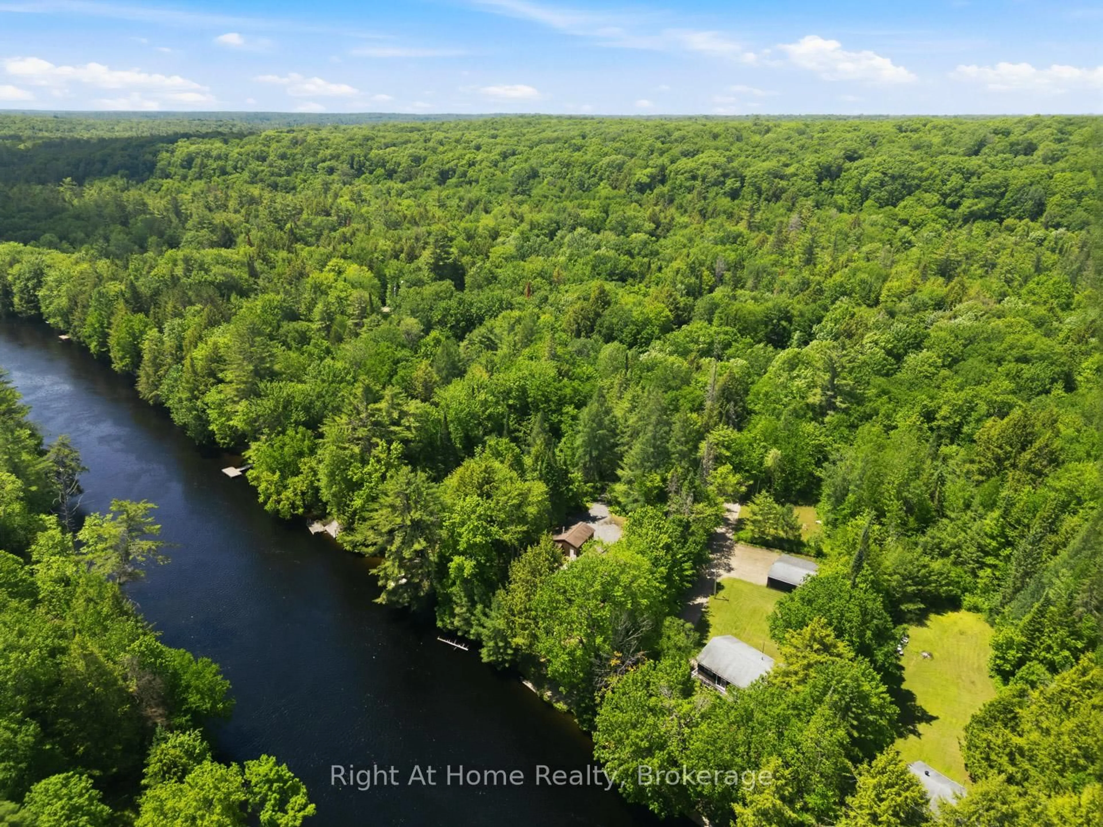 A pic from outside/outdoor area/front of a property/back of a property/a pic from drone, water/lake/river/ocean view for 1074 Holiday Park Dr, Bracebridge Ontario P1L 1W9