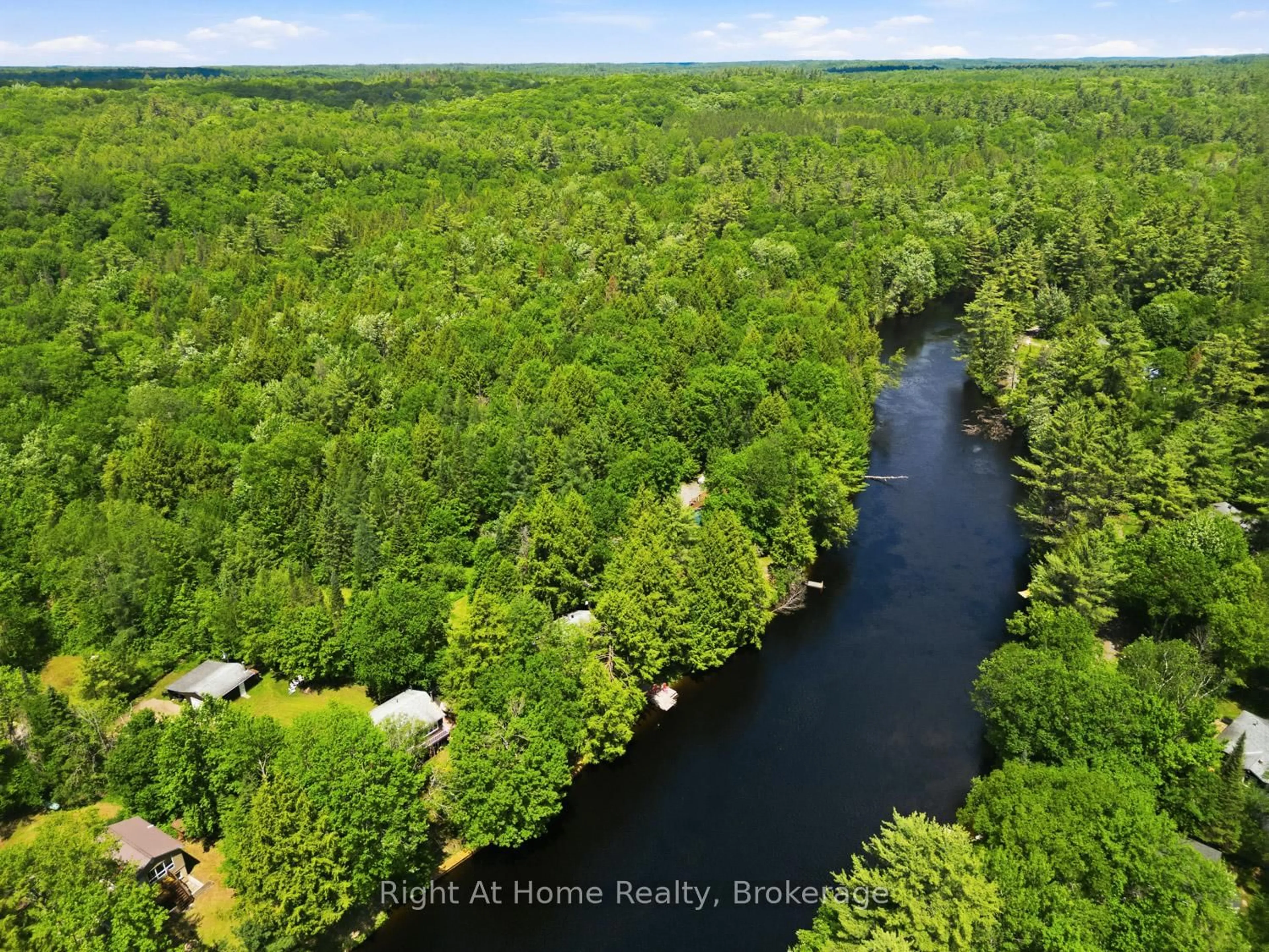 A pic from outside/outdoor area/front of a property/back of a property/a pic from drone, water/lake/river/ocean view for 1074 Holiday Park Dr, Bracebridge Ontario P1L 1W9