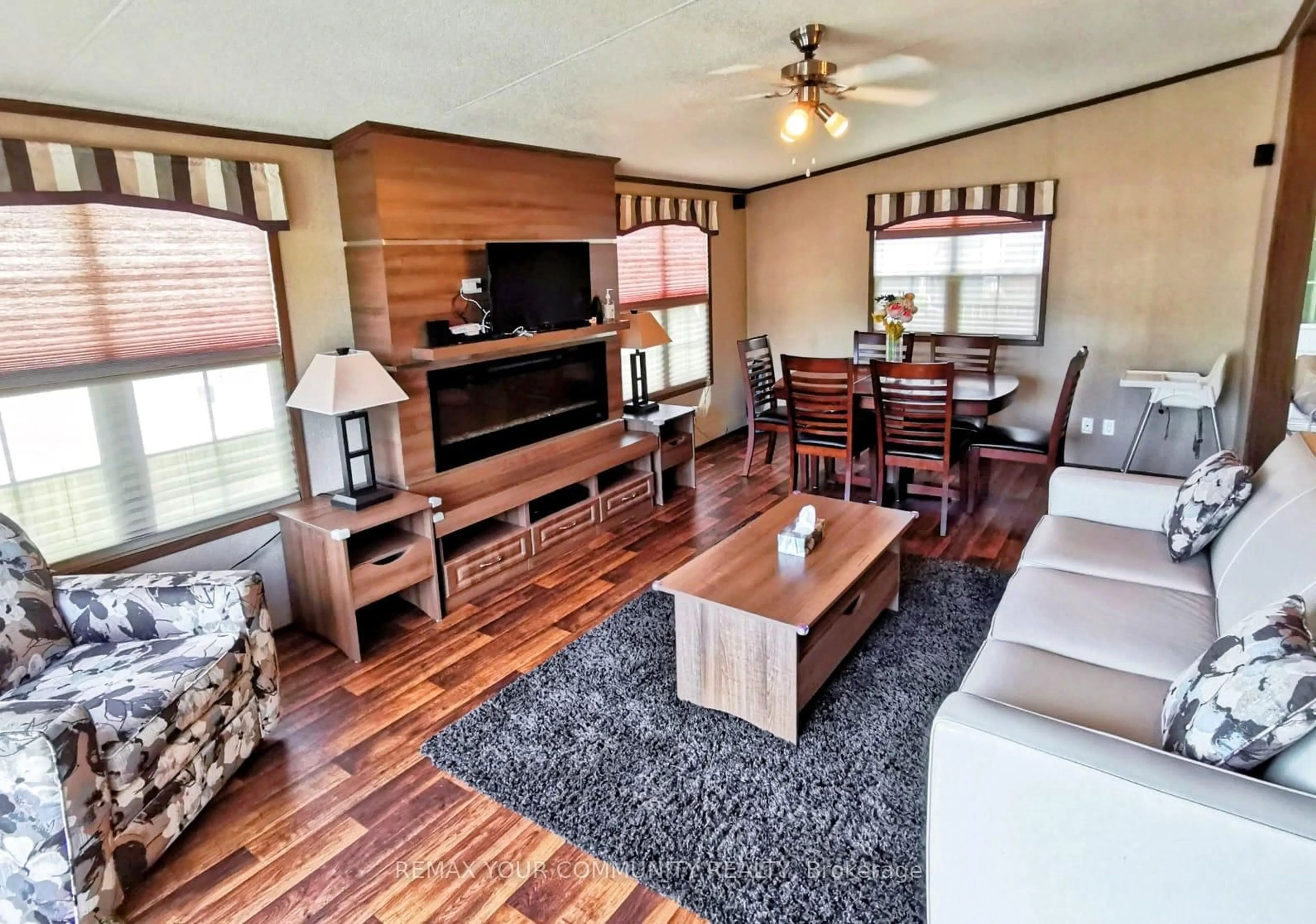 Living room with furniture, wood/laminate floor for 1501 Line 8 Rd #251, Niagara-on-the-Lake Ontario L0S 1L0