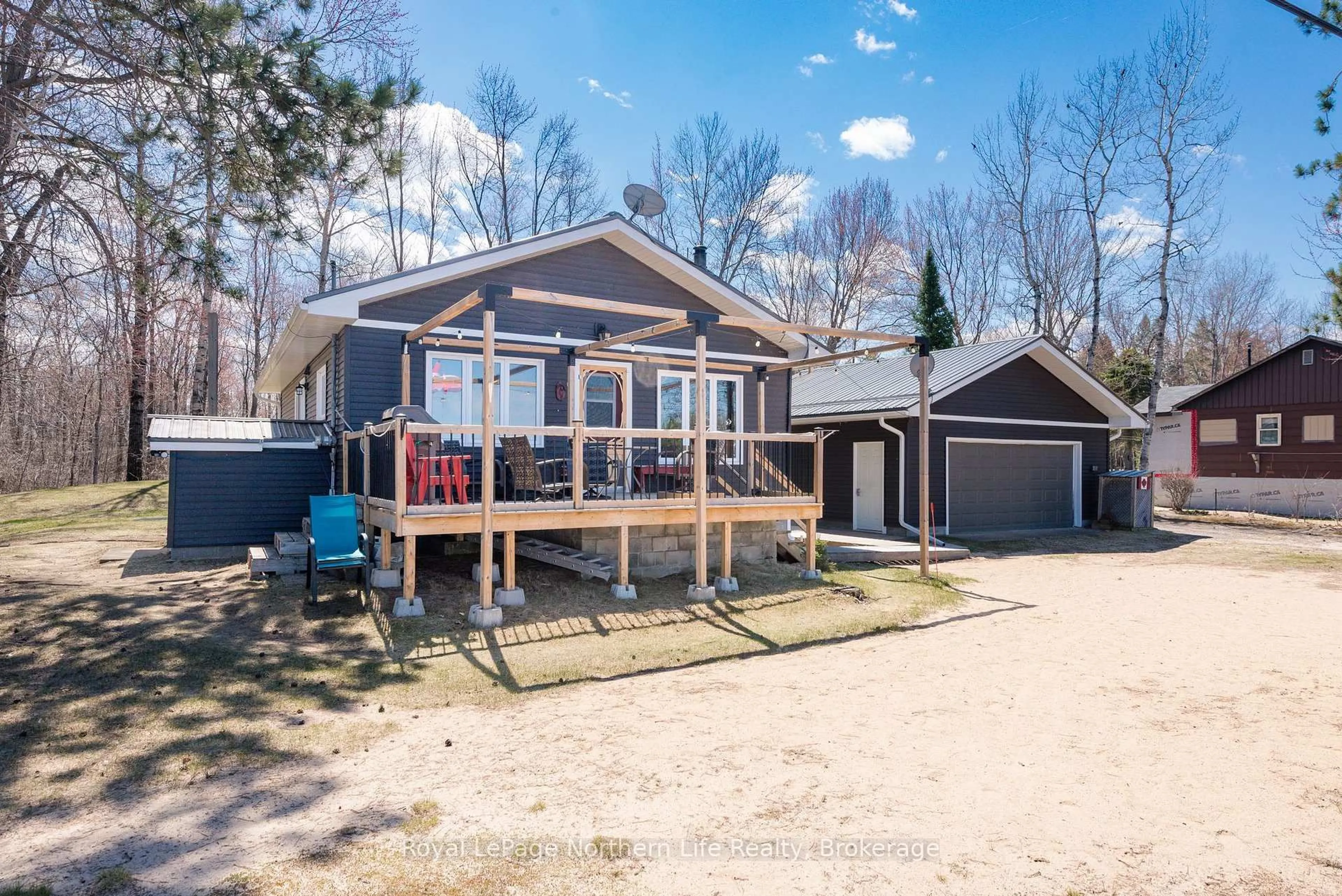 A pic from outside/outdoor area/front of a property/back of a property/a pic from drone, water/lake/river/ocean view for 405 Bear Creek Rd, Nipissing Ontario P0H 1H0