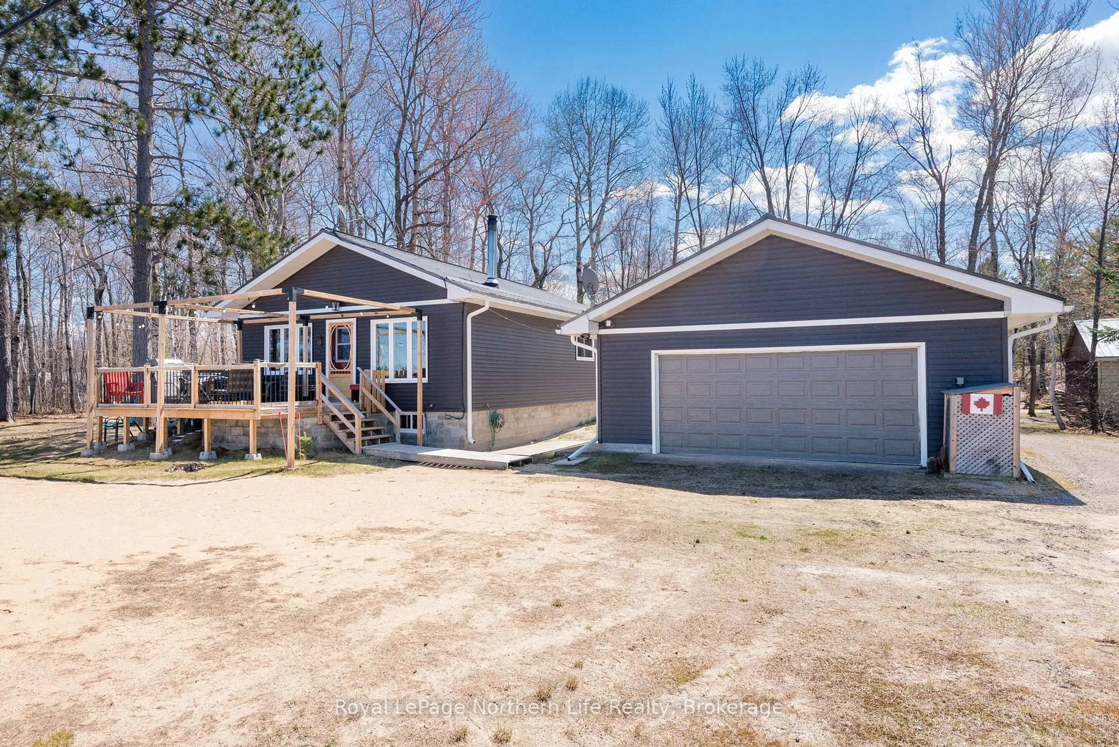 Home with vinyl exterior material, street for 405 Bear Creek Rd, Nipissing Ontario P0H 1H0