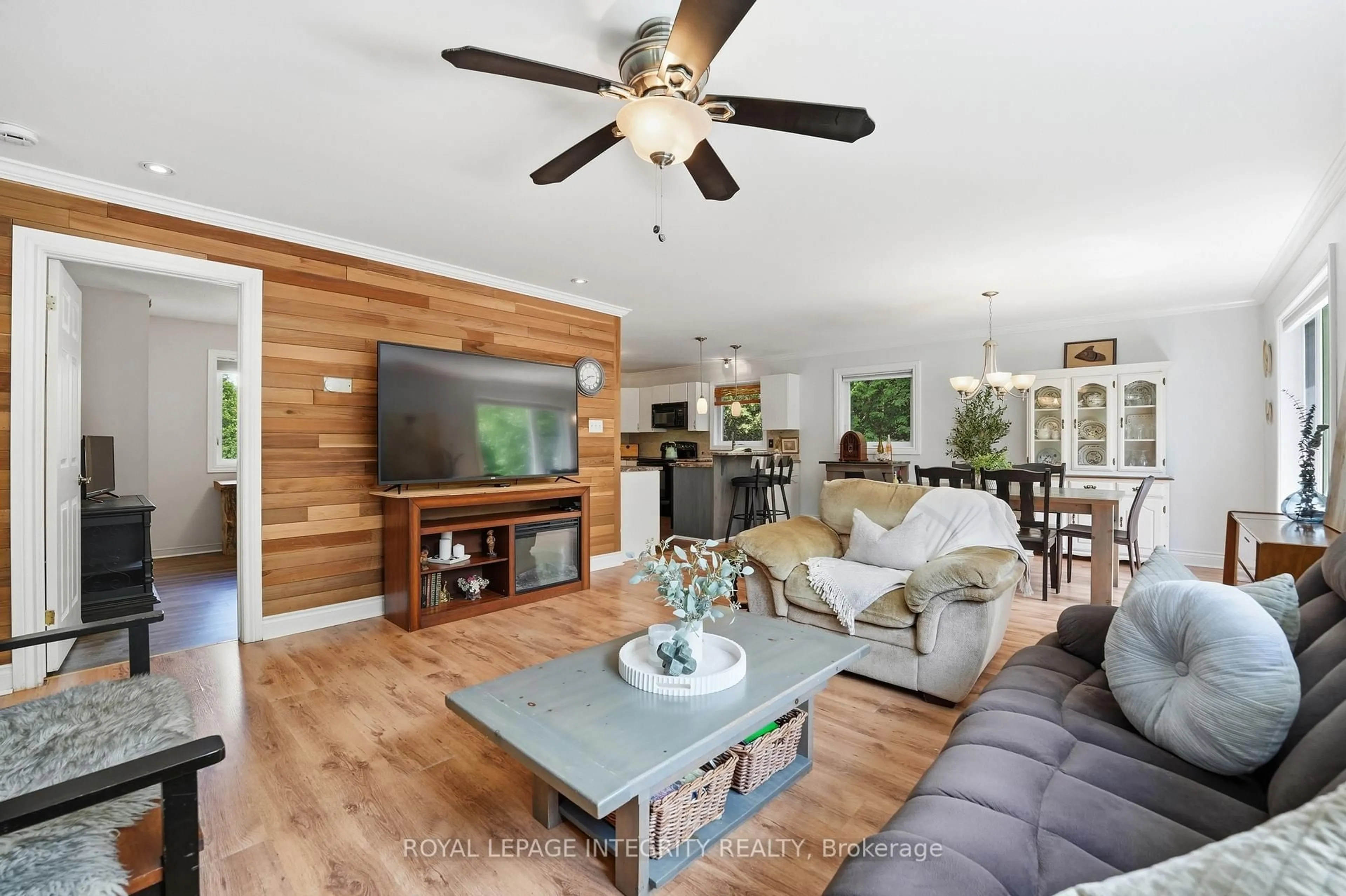 Living room with furniture, wood/laminate floor for 215 Davis Rd, North Grenville Ontario K0G 1N0