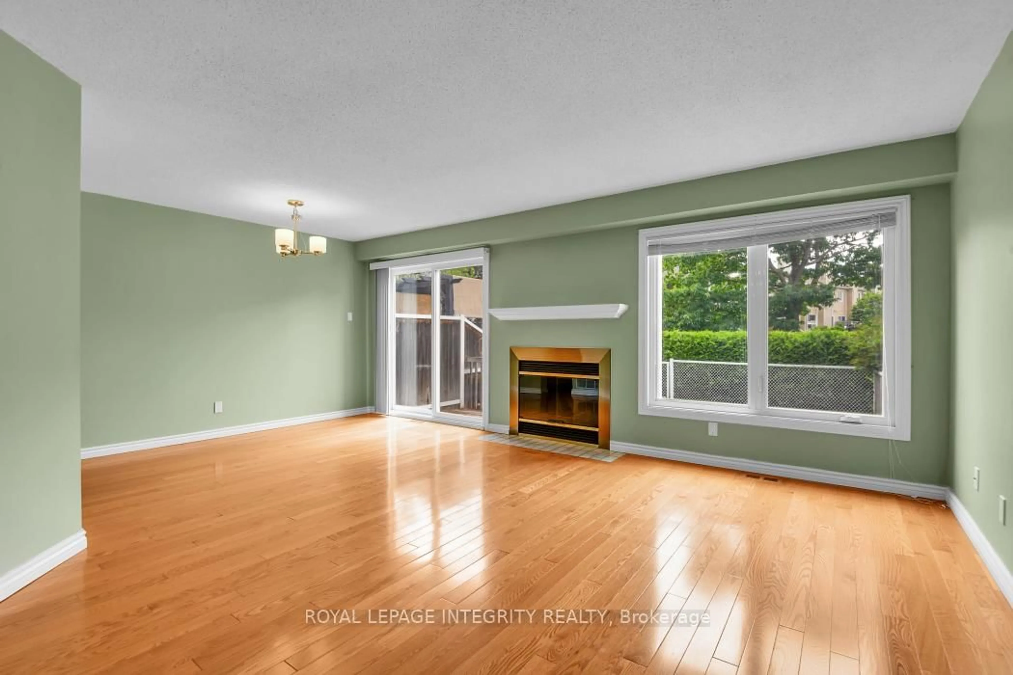 Living room with furniture, wood/laminate floor for 6176 Oak Meadows Drive Dr, Ottawa Ontario K1C 7G8