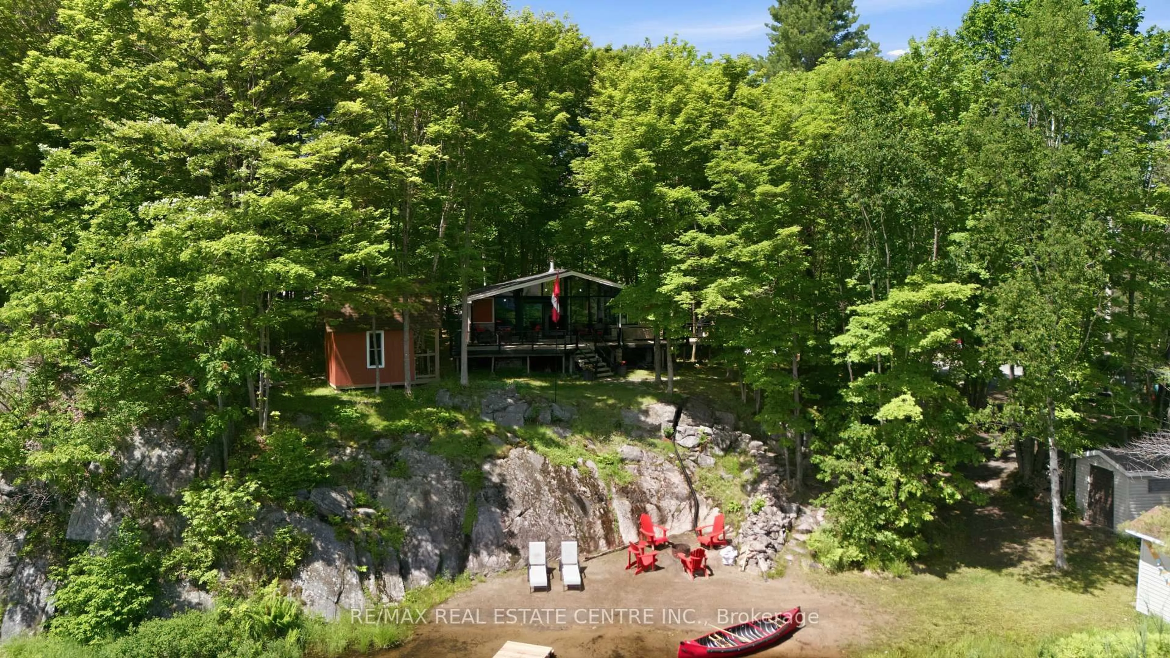 A pic from outside/outdoor area/front of a property/back of a property/a pic from drone, water/lake/river/ocean view for 87 Pinewood Rd, McDougall Ontario P2A 2W7