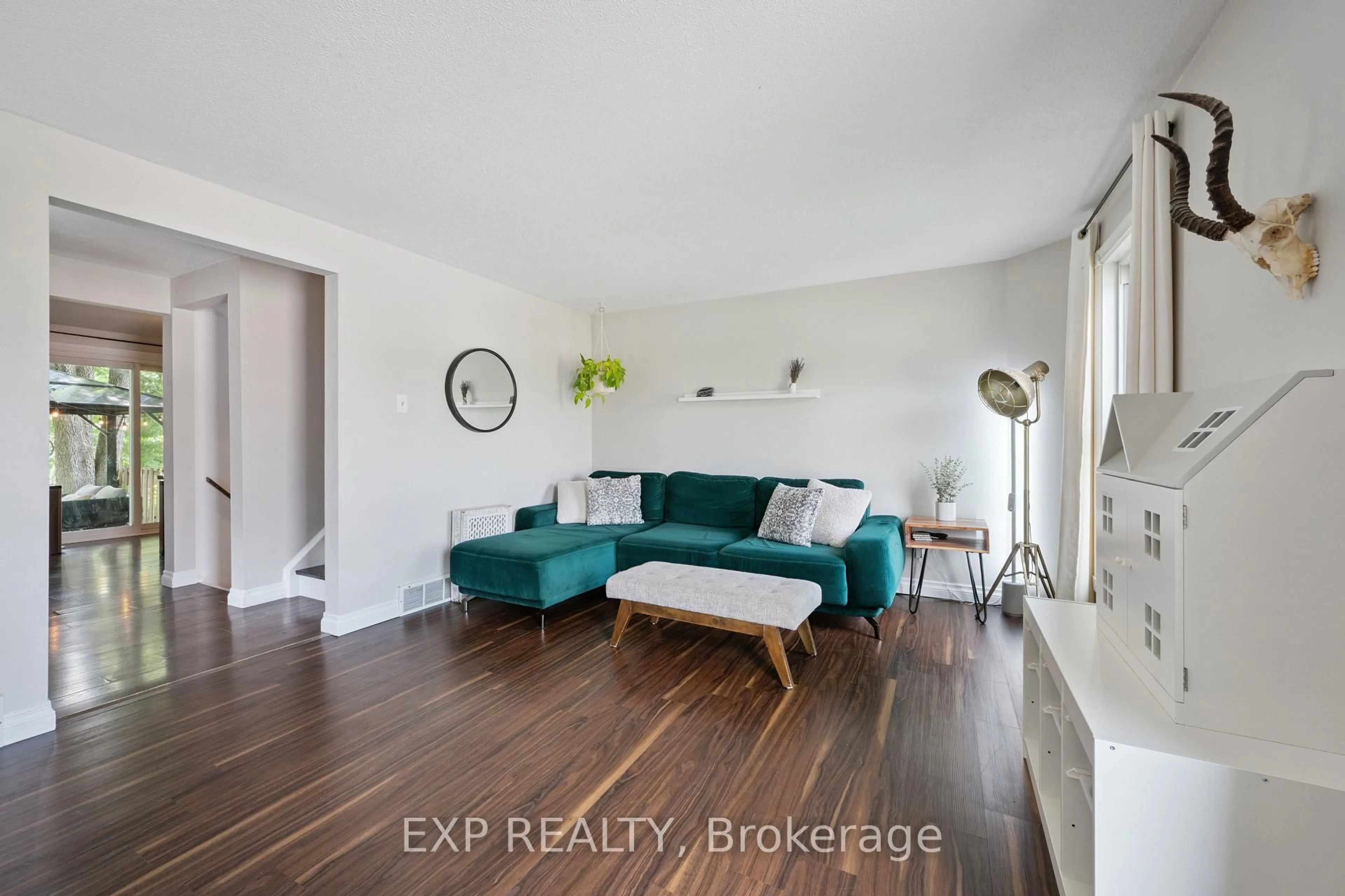 Living room with furniture, wood/laminate floor for 124 Sanderson Dr, Guelph Ontario N1H 7L9