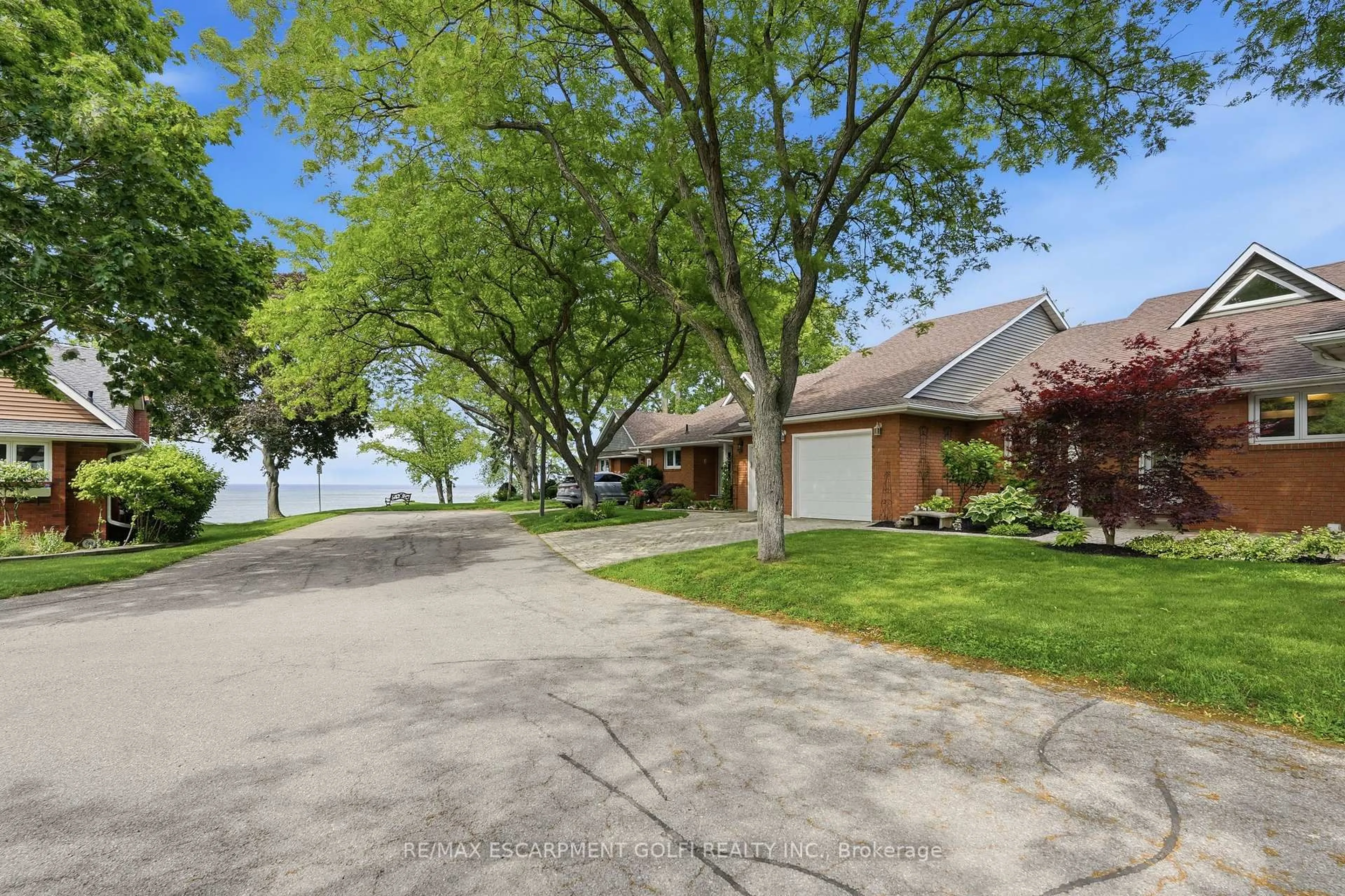 A pic from outside/outdoor area/front of a property/back of a property/a pic from drone, water/lake/river/ocean view for 375 Book Rd #7, Grimsby Ontario L3M 2M8