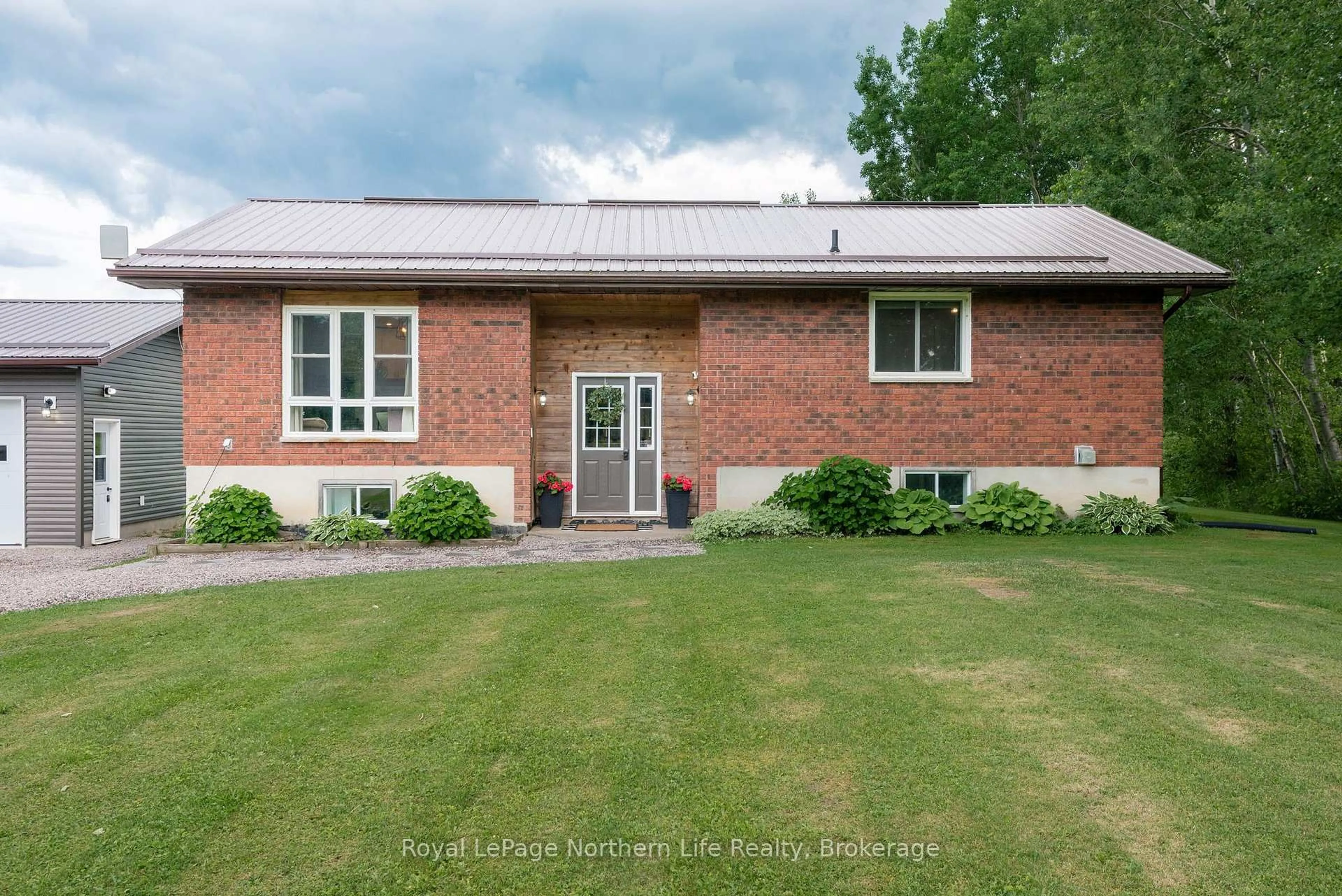 Home with brick exterior material, street for 989 Pioneer Rd, Chisholm Ontario P0H 1Z0