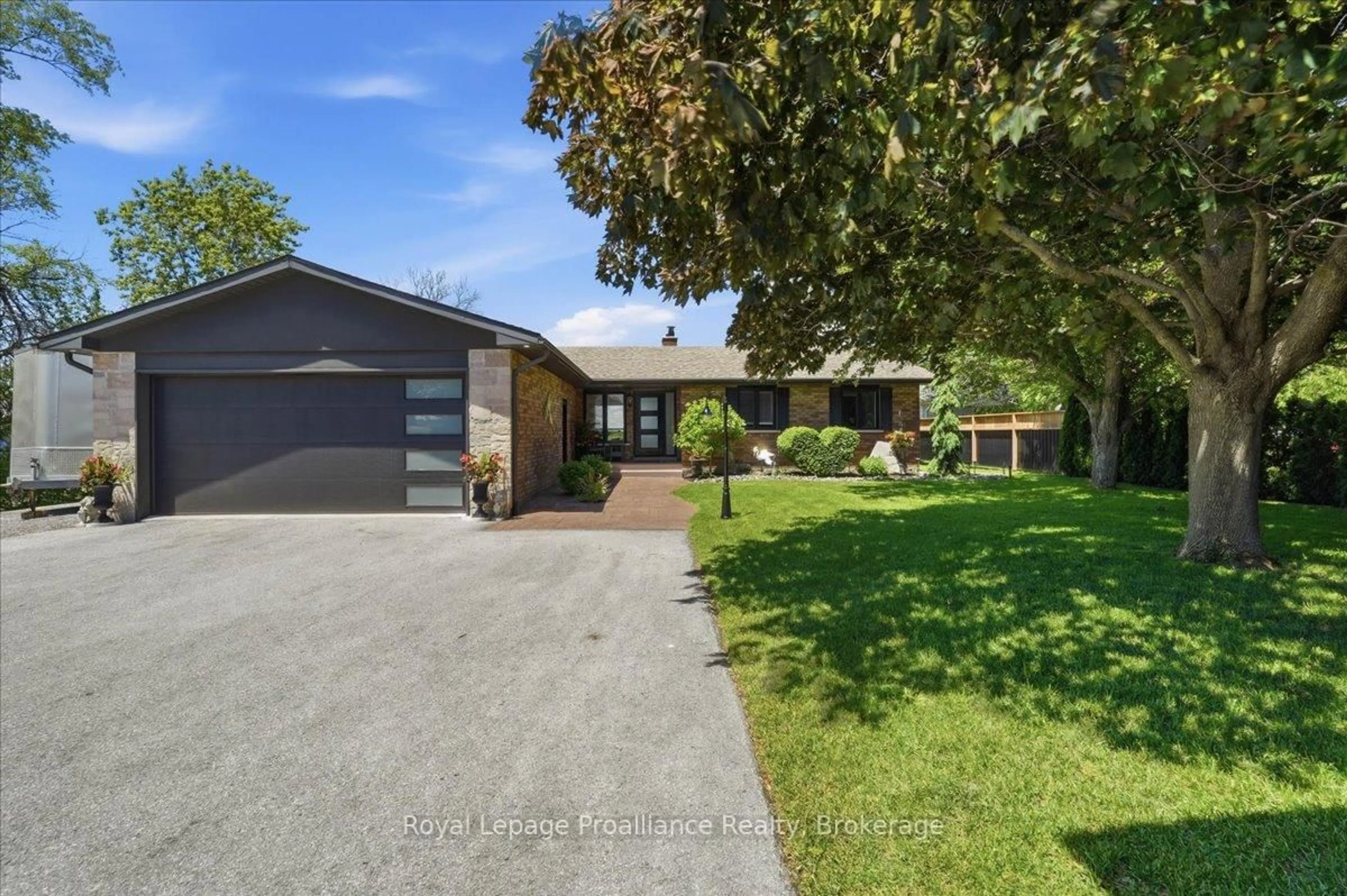 A pic from outside/outdoor area/front of a property/back of a property/a pic from drone, street for 2728 County Road 3, Prince Edward County Ontario K0K 1L0