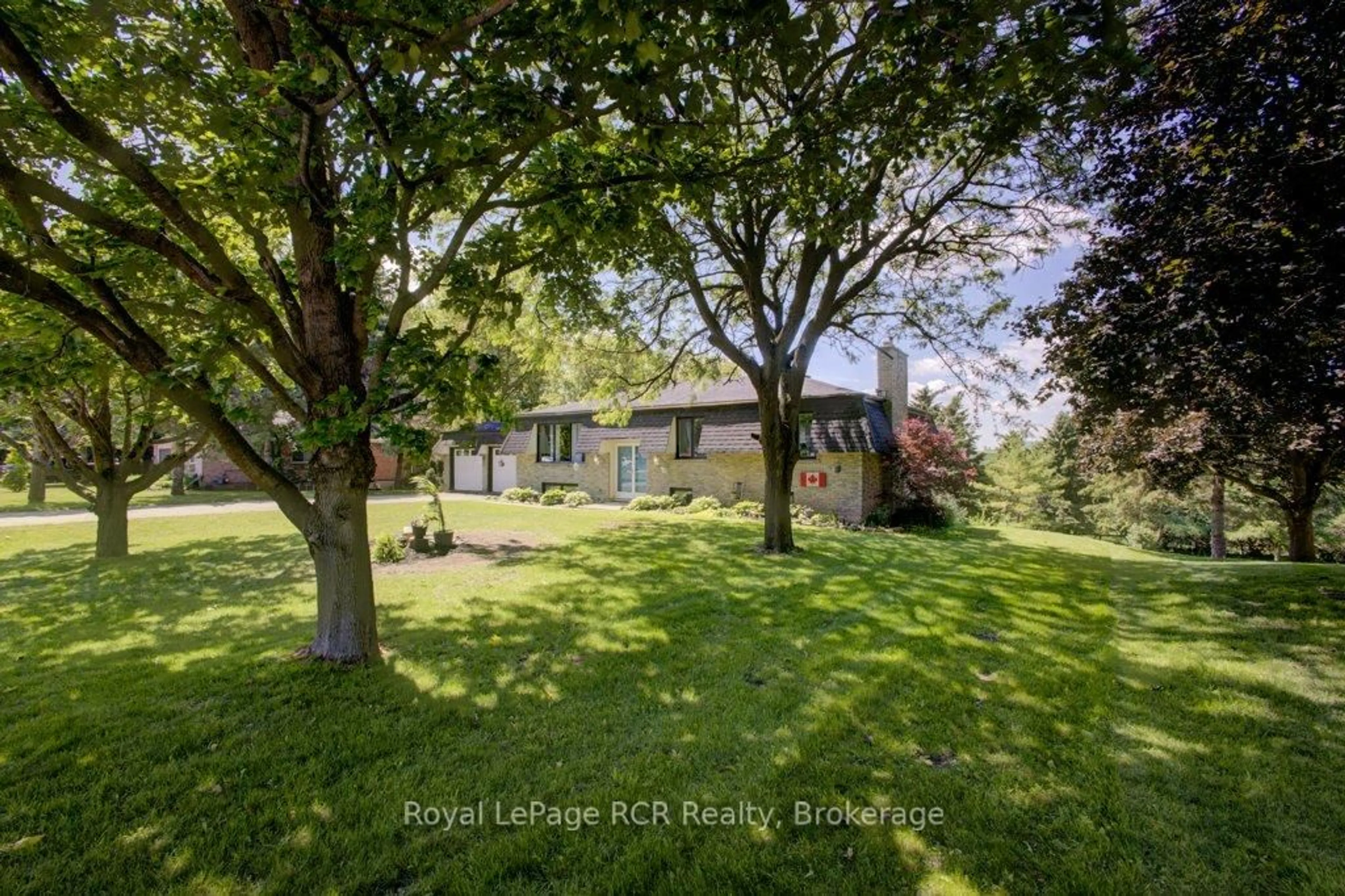 A pic from outside/outdoor area/front of a property/back of a property/a pic from drone, forest/trees view for 15 Booth St, Mapleton Ontario N0G 2K0