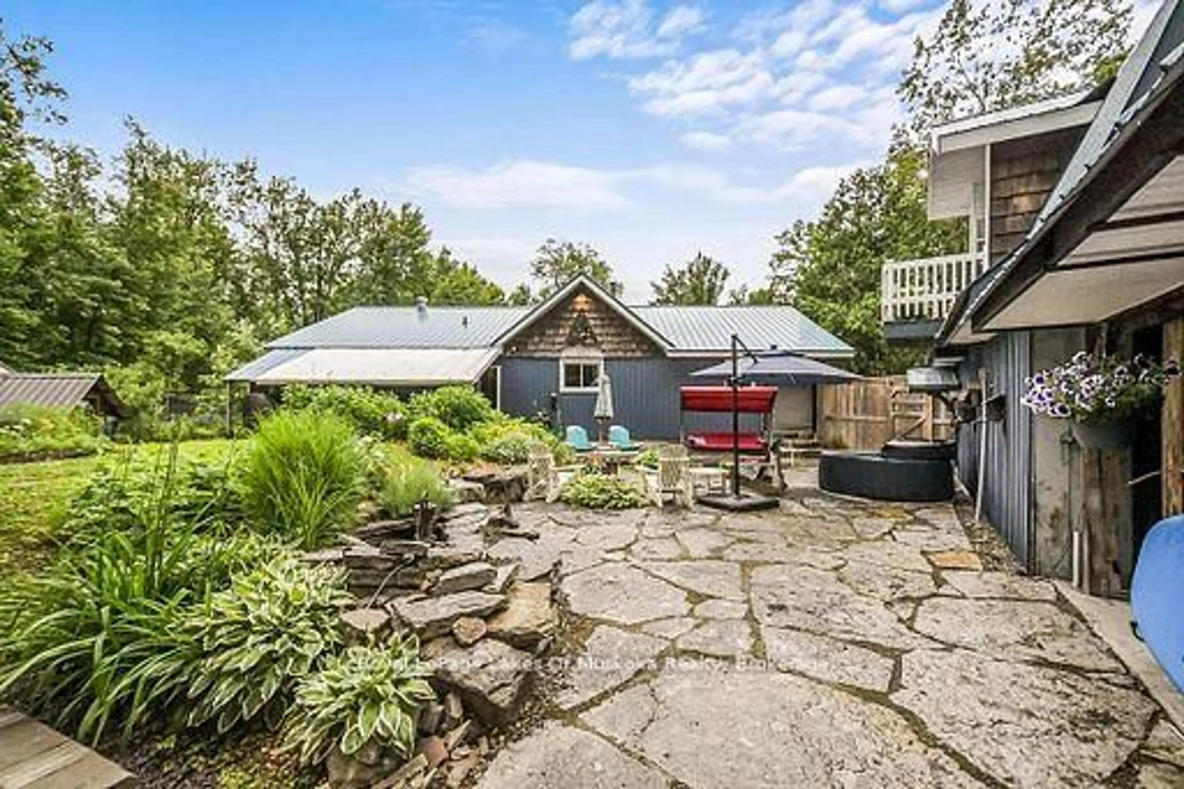 A pic from outside/outdoor area/front of a property/back of a property/a pic from drone, water/lake/river/ocean view for 1005 Kirby's Beach Rd, Bracebridge Ontario P1L 1X2
