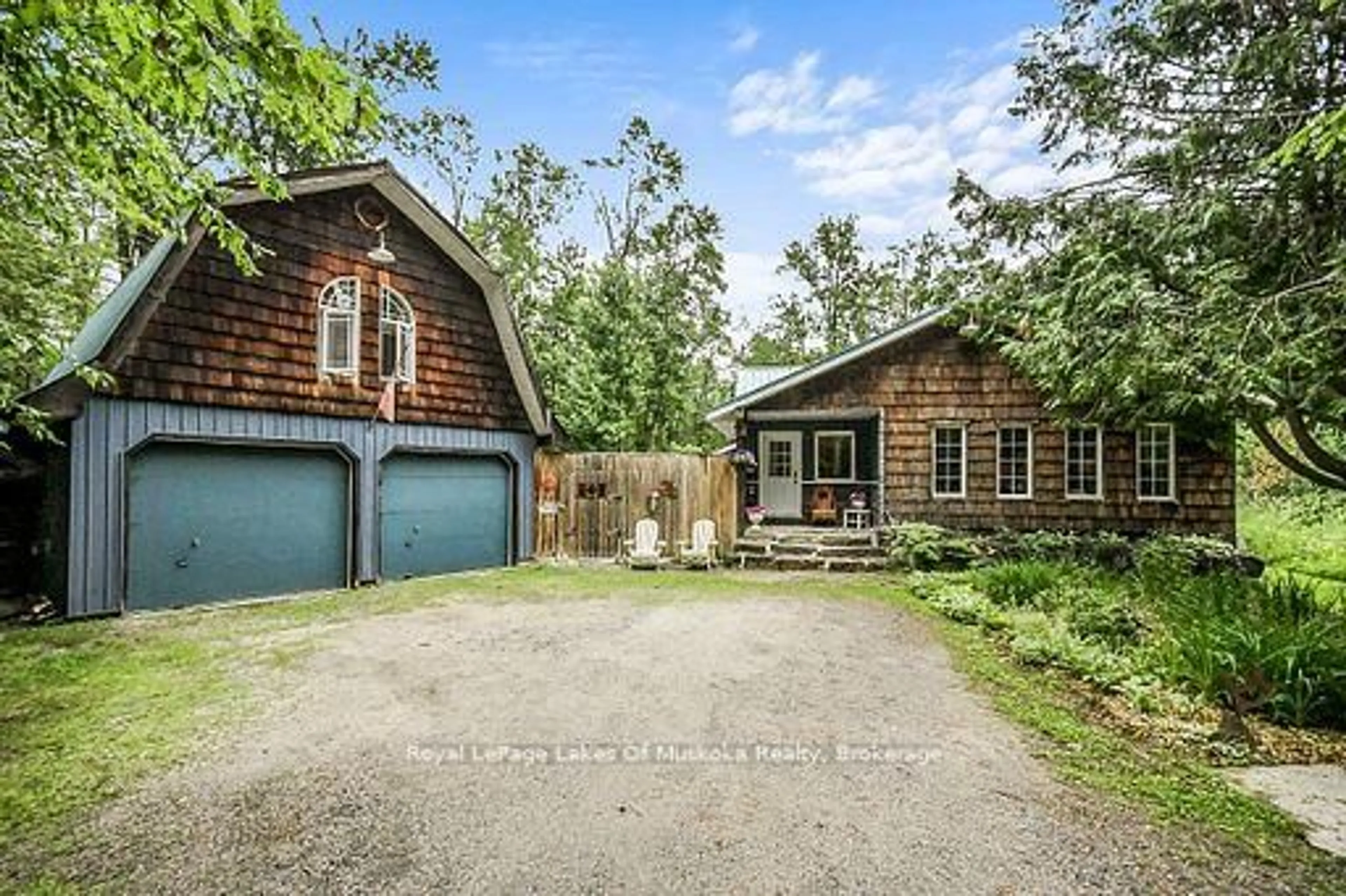 A pic from outside/outdoor area/front of a property/back of a property/a pic from drone, street for 1005 Kirby's Beach Rd, Bracebridge Ontario P1L 1X2