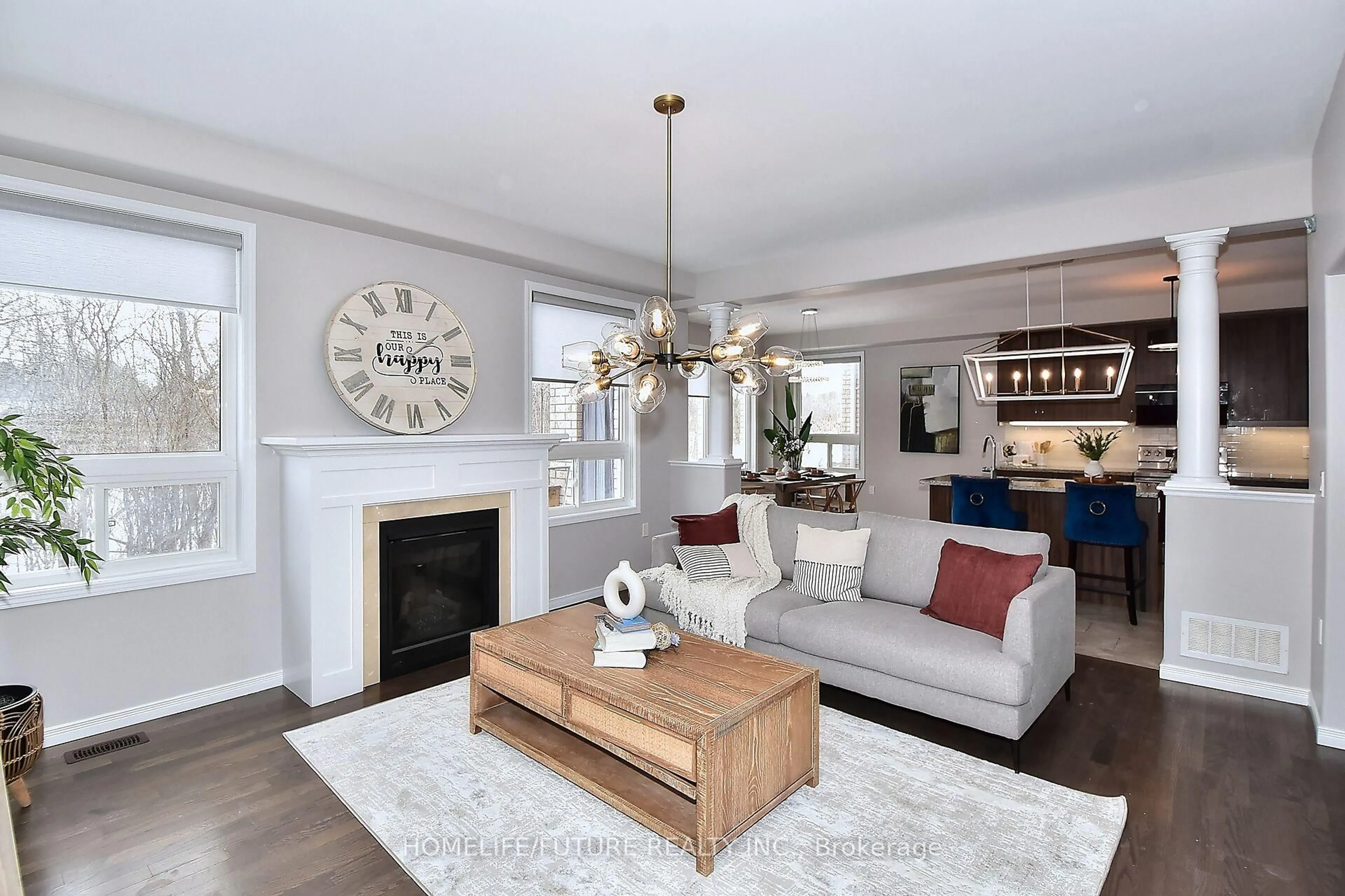 Living room with furniture, wood/laminate floor for 39 Summer Lane, Selwyn Ontario K9L 0G4
