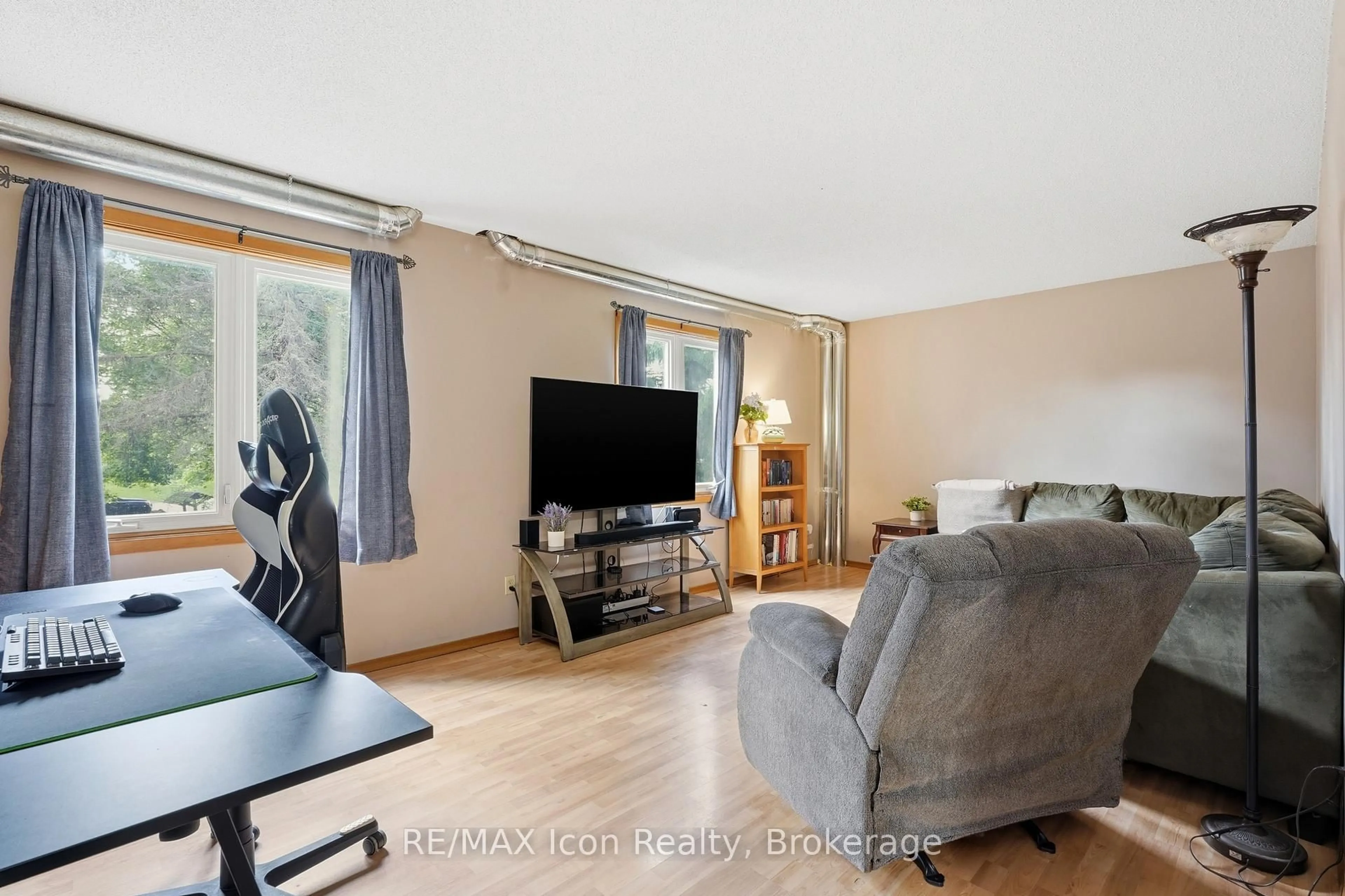 Living room with furniture, wood/laminate floor for 7239 Wellington Rd 21, Centre Wellington Ontario N0B 1B0