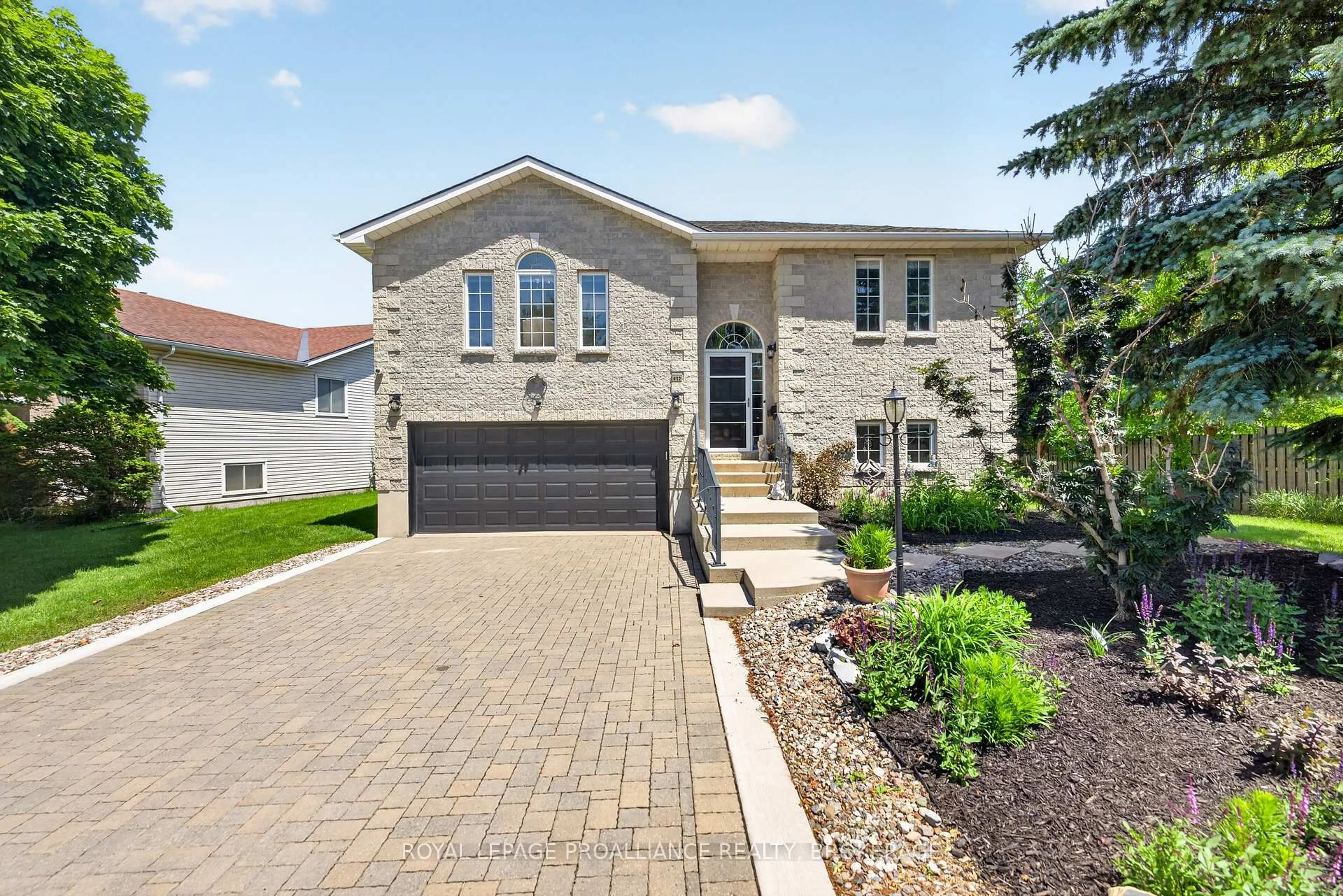 Home with brick exterior material, street for 412 Malabar Dr, Kingston Ontario K7M 8Z5