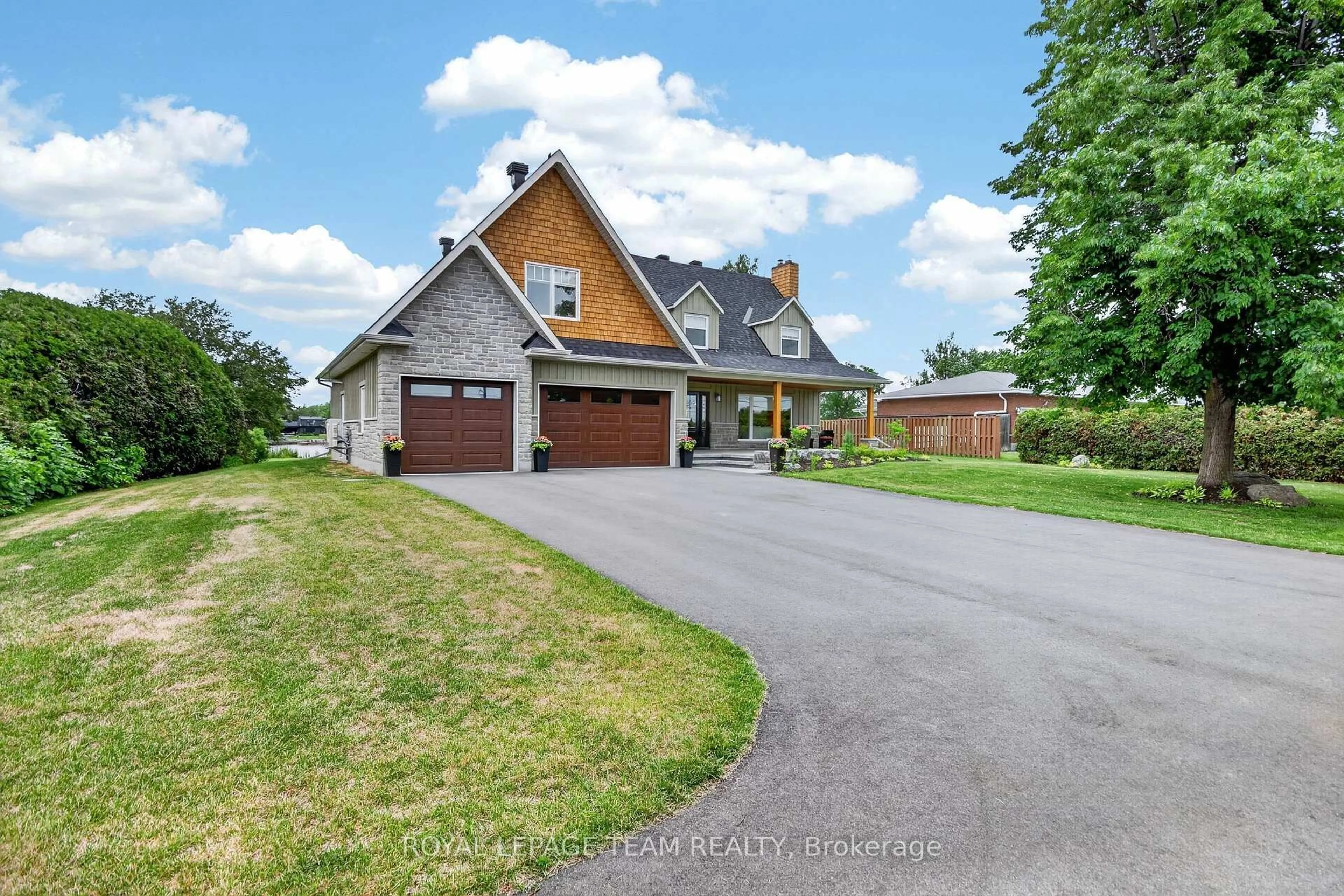 A pic from outside/outdoor area/front of a property/back of a property/a pic from drone, unknown for 2710 River Rd, Manotick Ontario K4M 1A3