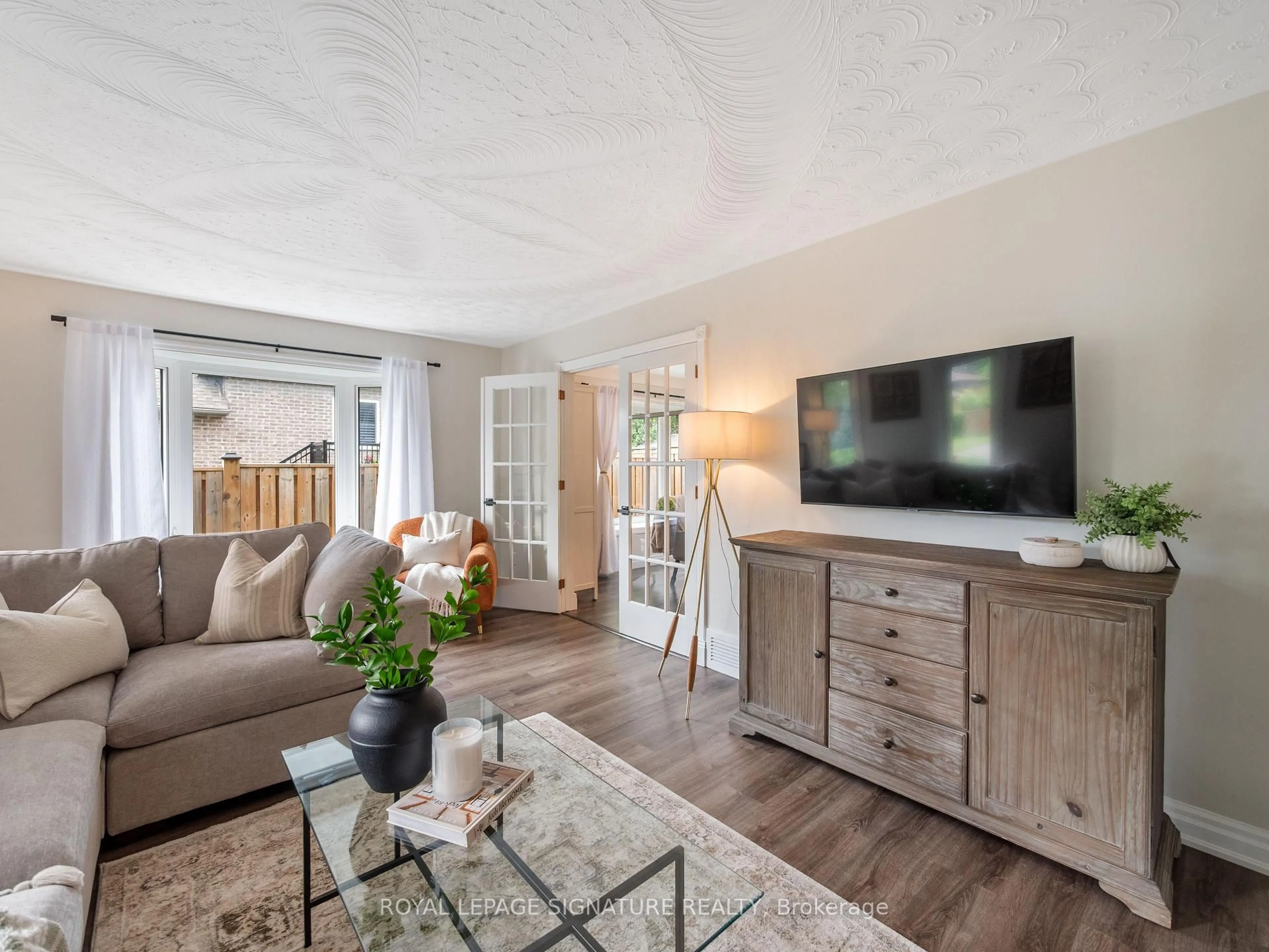 Living room with furniture, wood/laminate floor for 245 Appleby Rd, Hamilton Ontario L9G 2V6