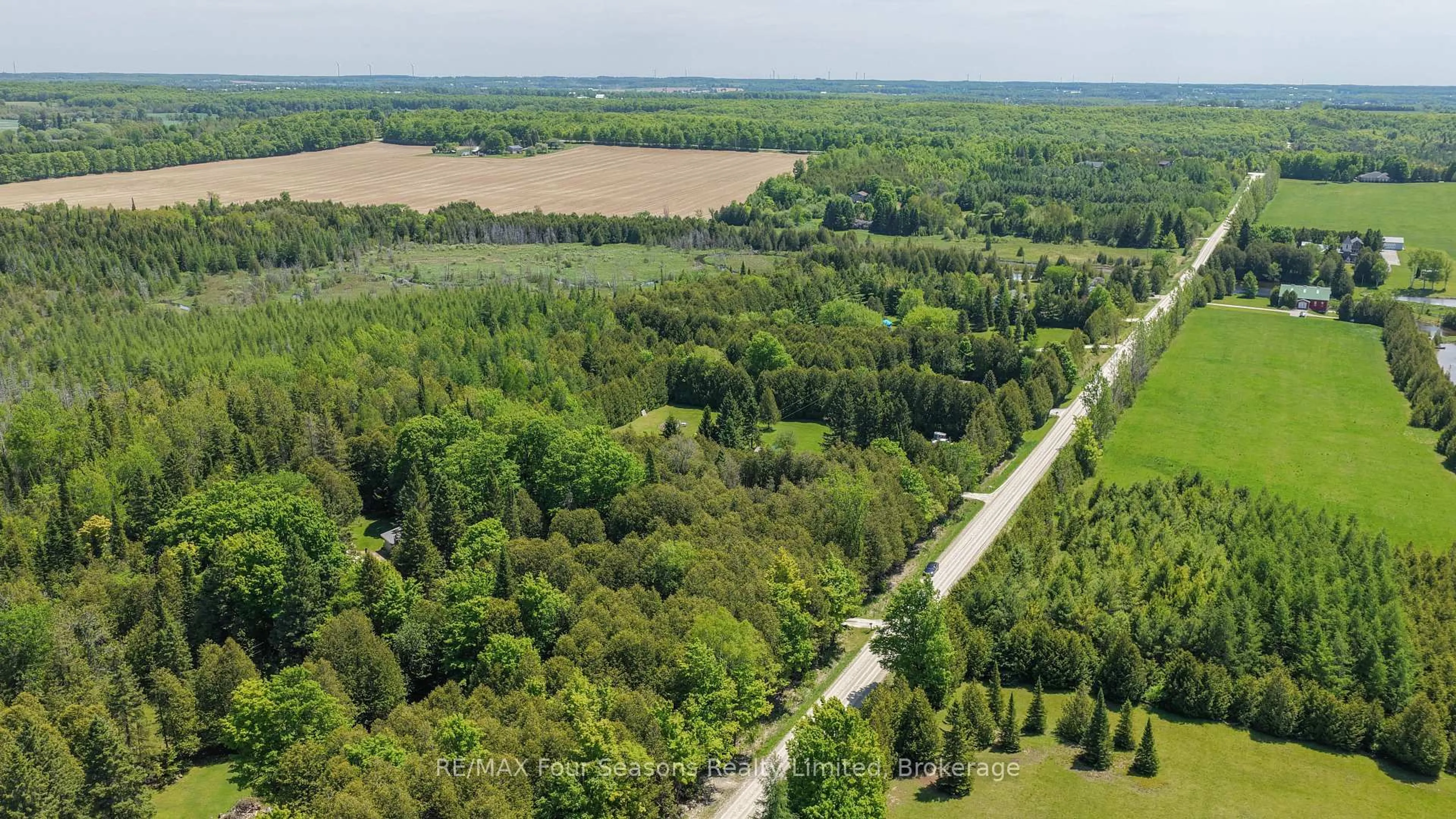 A pic from outside/outdoor area/front of a property/back of a property/a pic from drone, forest/trees view for 35451 Osprey Artemesia Rr 4 Rd, Grey Highlands Ontario N0C 1E0