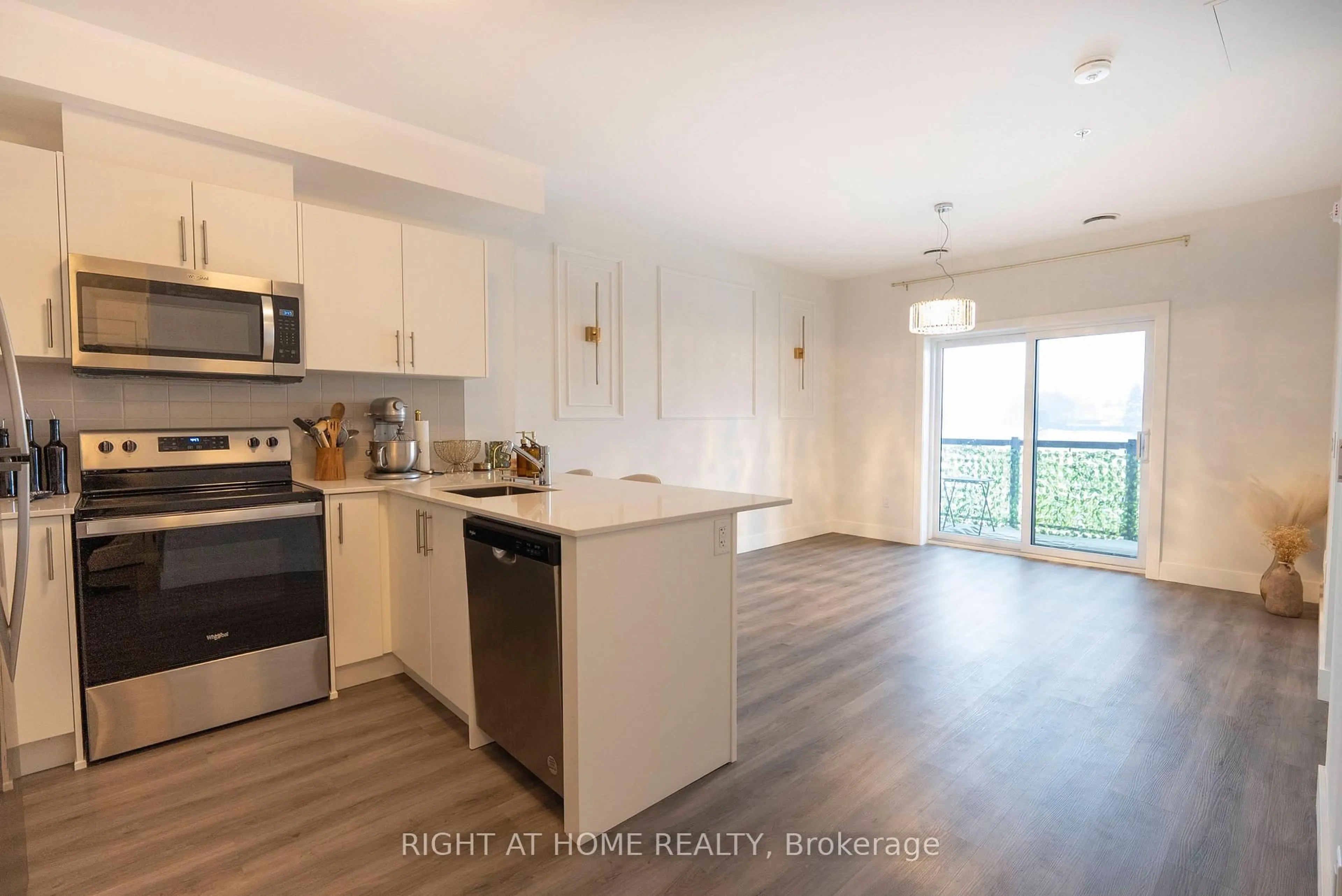 Open concept kitchen, wood/laminate floor for 1000 Lackner Pl #302, Kitchener Ontario N2A 0L9