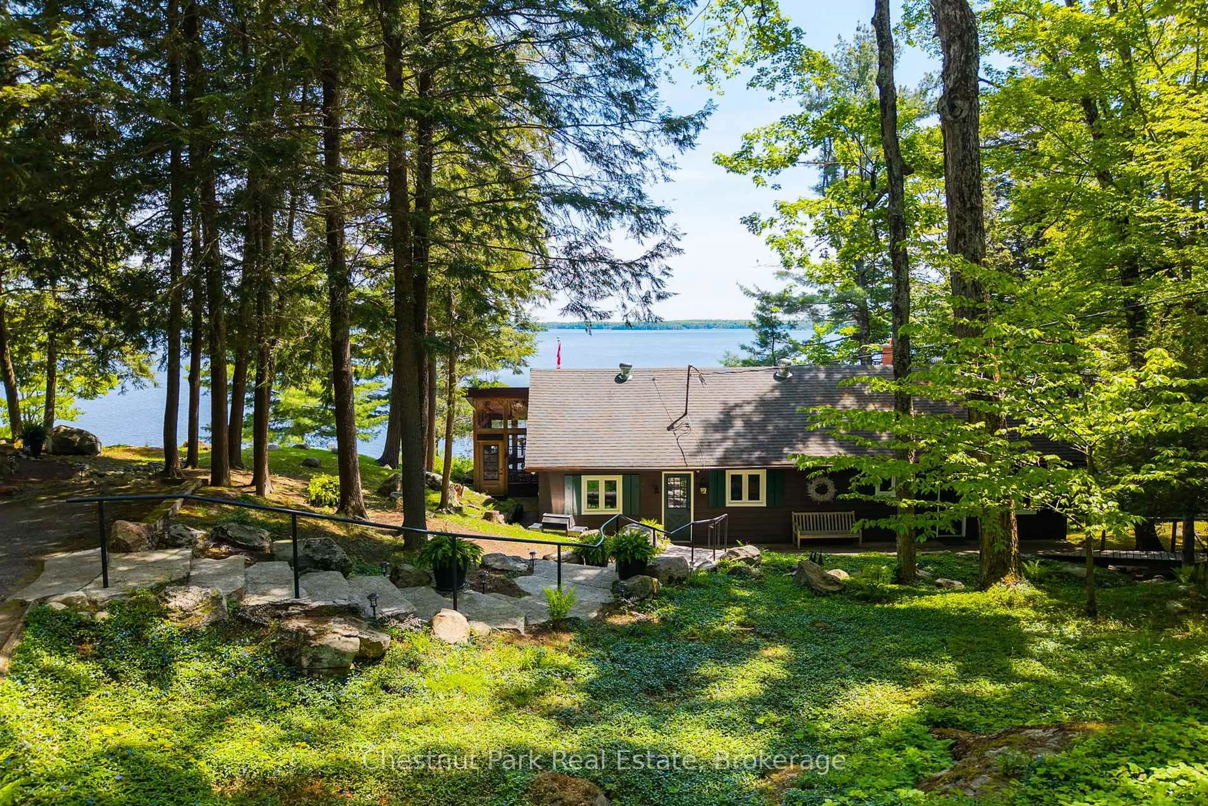A pic from outside/outdoor area/front of a property/back of a property/a pic from drone, water/lake/river/ocean view for 1160 Whiteside Rd #51A, Muskoka Lakes Ontario P0B 1J0
