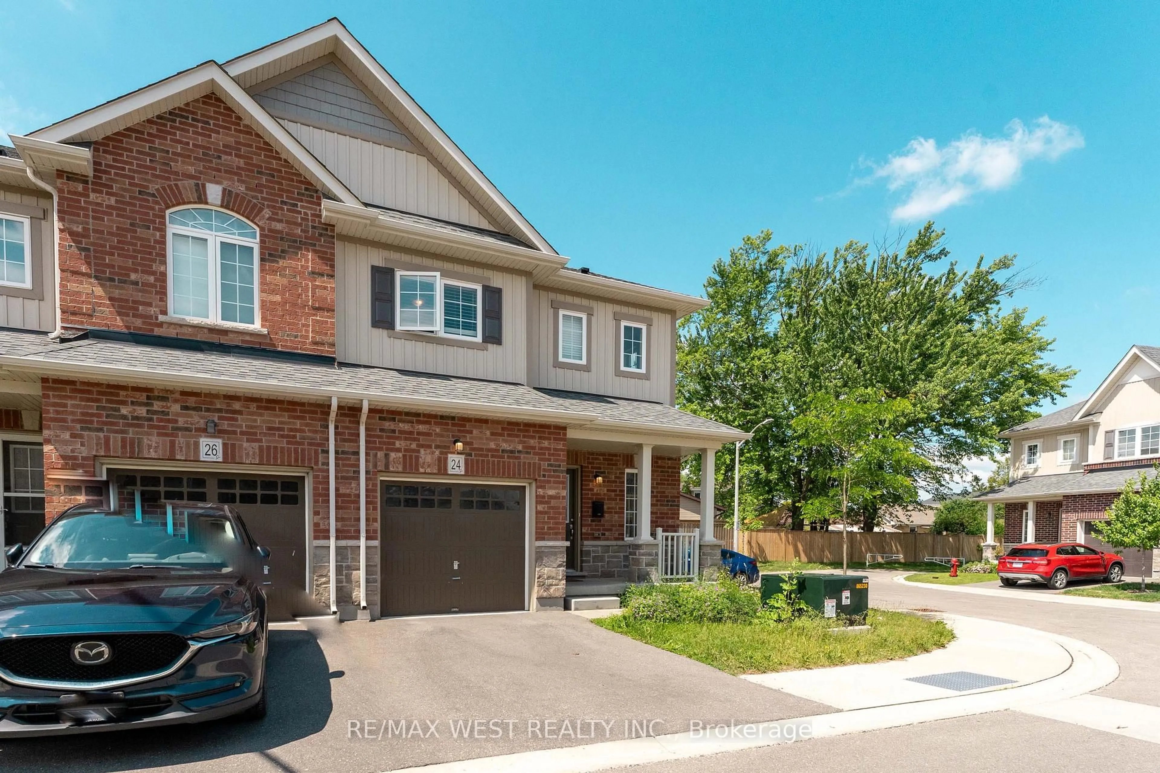 Home with brick exterior material, street for 24 Dewberry Dr, Kitchener Ontario N2B 0A9