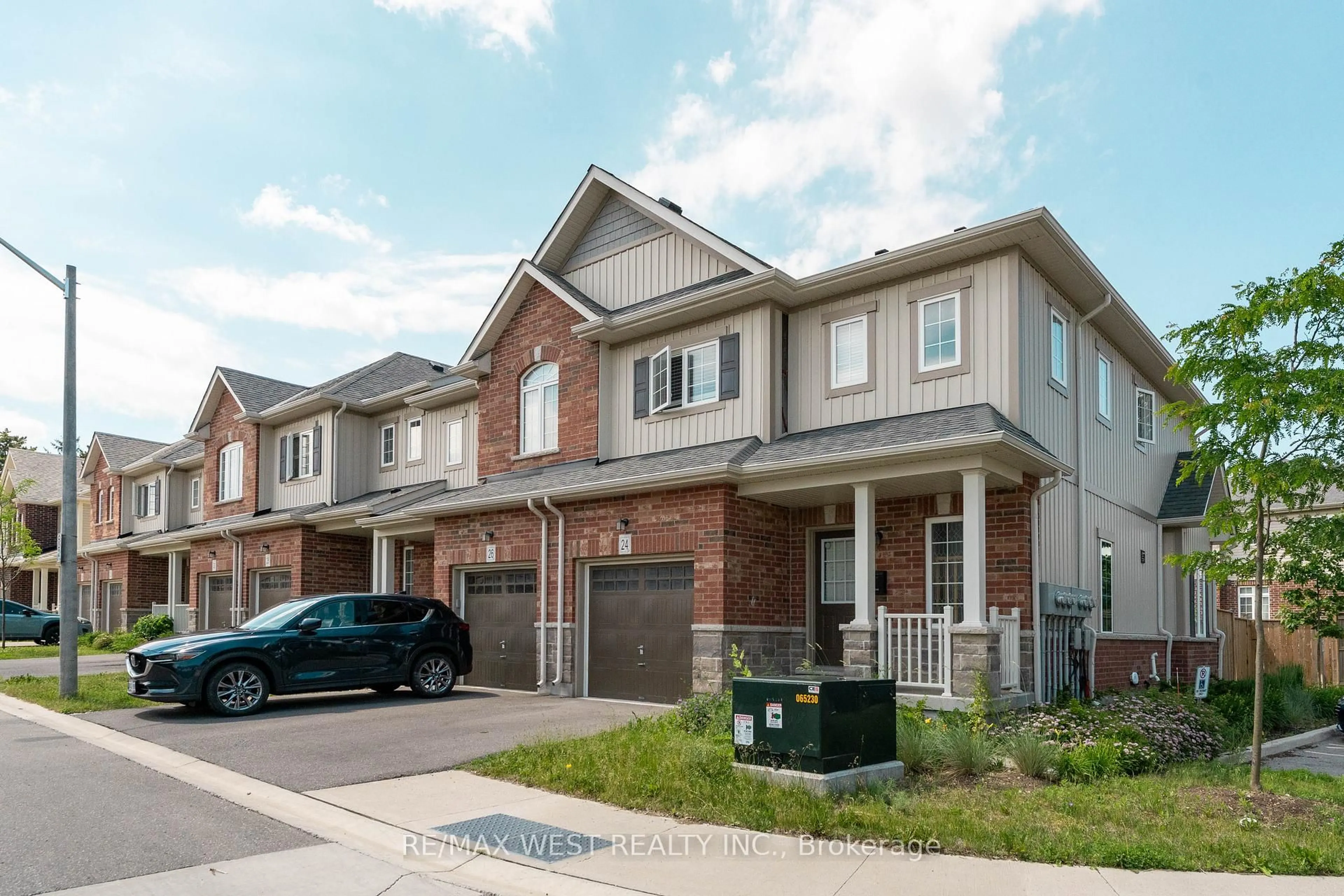 Home with brick exterior material, street for 24 Dewberry Dr, Kitchener Ontario N2B 0A9