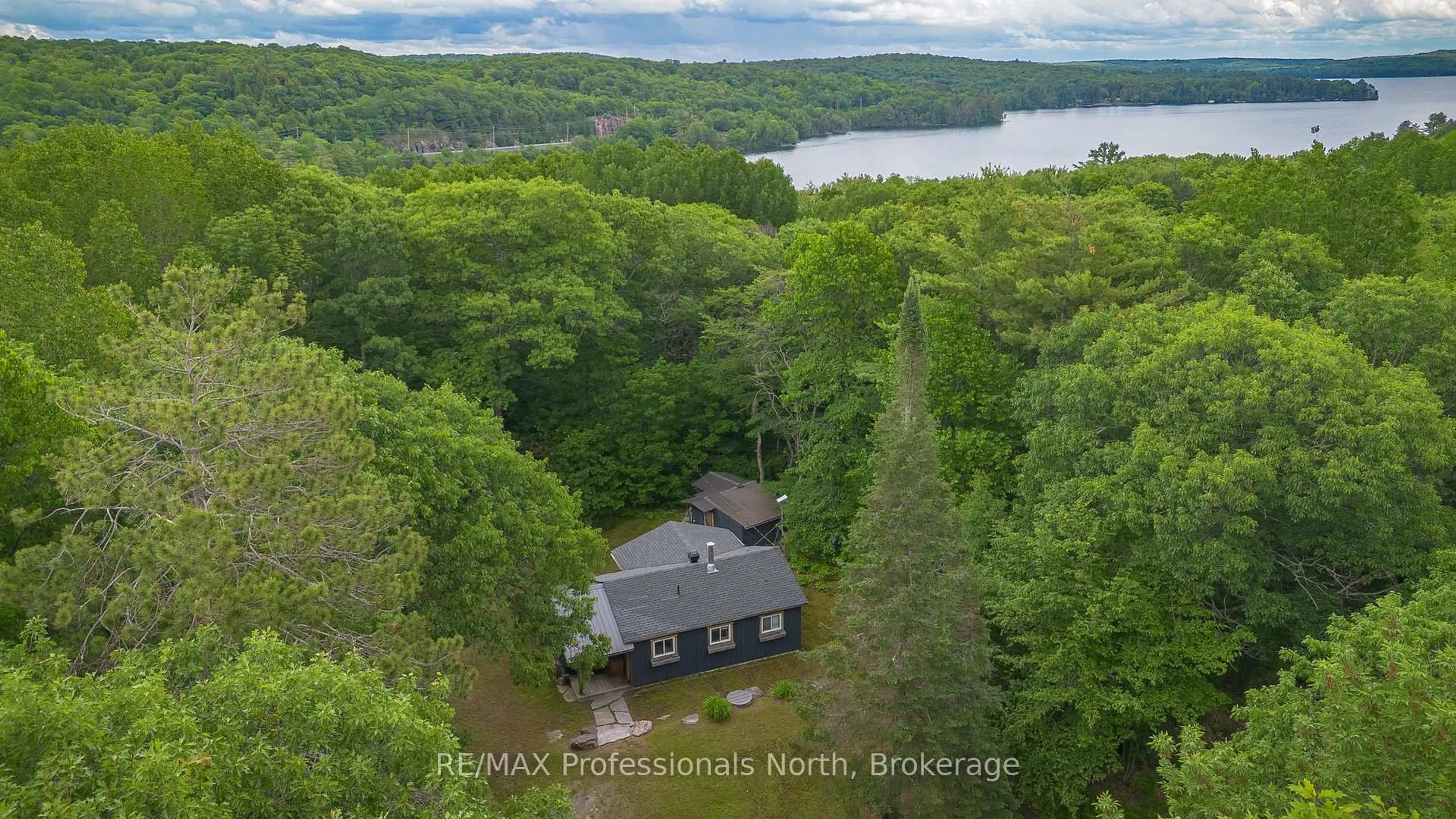 A pic from outside/outdoor area/front of a property/back of a property/a pic from drone, water/lake/river/ocean view for 1628 Boshkung Lake Rd, Algonquin Highlands Ontario K0M 1J1