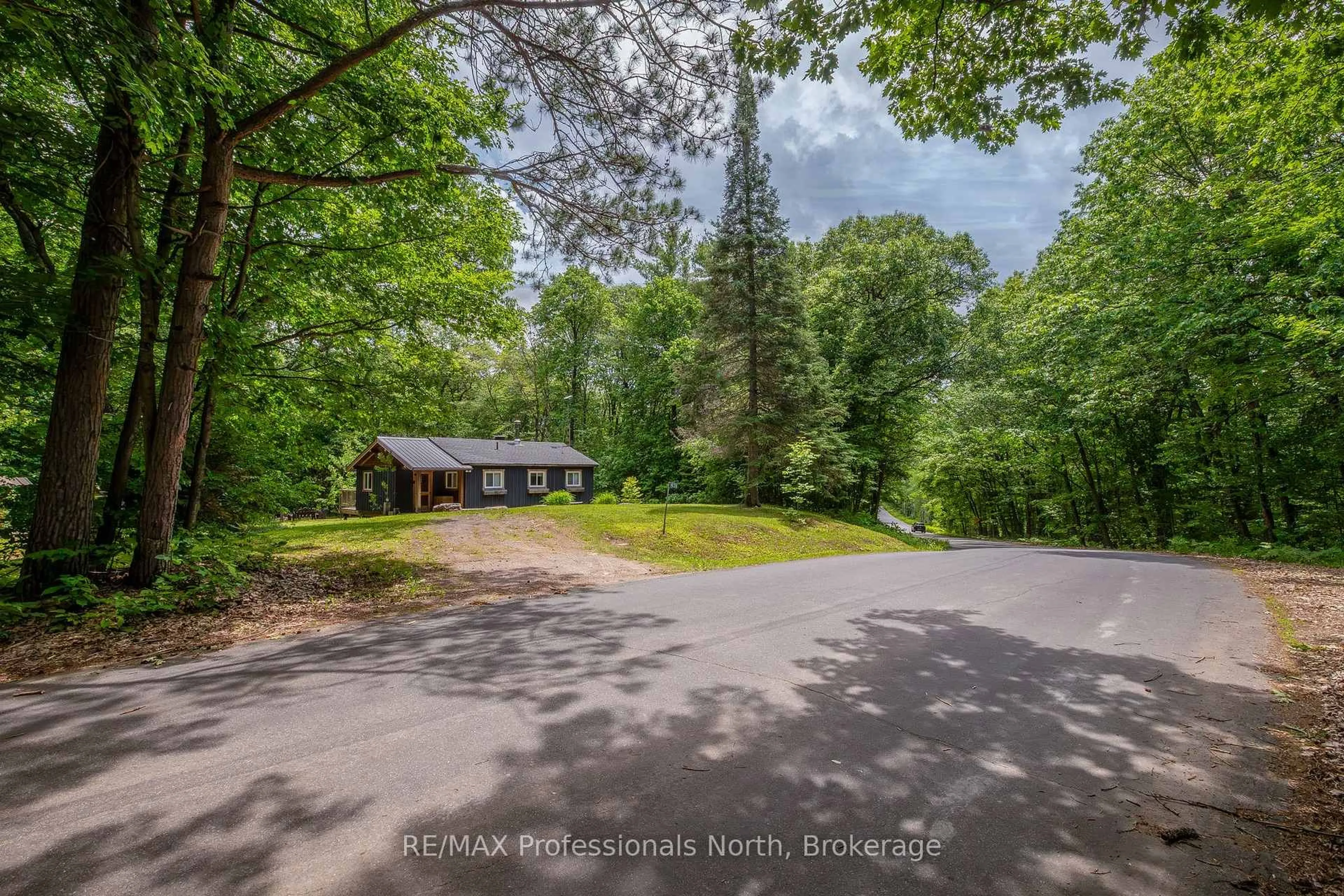 A pic from outside/outdoor area/front of a property/back of a property/a pic from drone, forest/trees view for 1628 Boshkung Lake Rd, Algonquin Highlands Ontario K0M 1J1