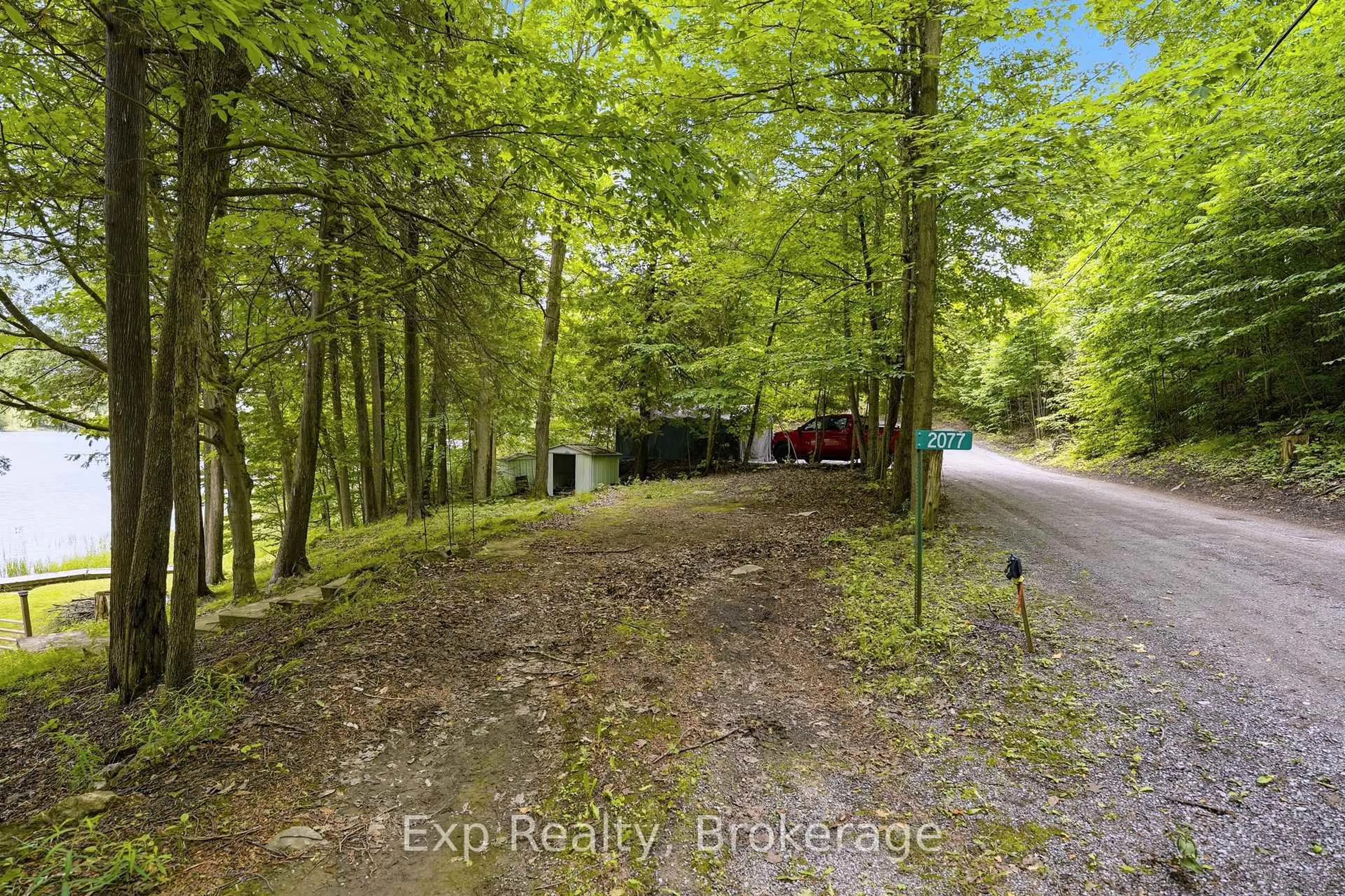 A pic from outside/outdoor area/front of a property/back of a property/a pic from drone, forest/trees view for 2077 Hambly Lane, Hartington Ontario K0H 1W0