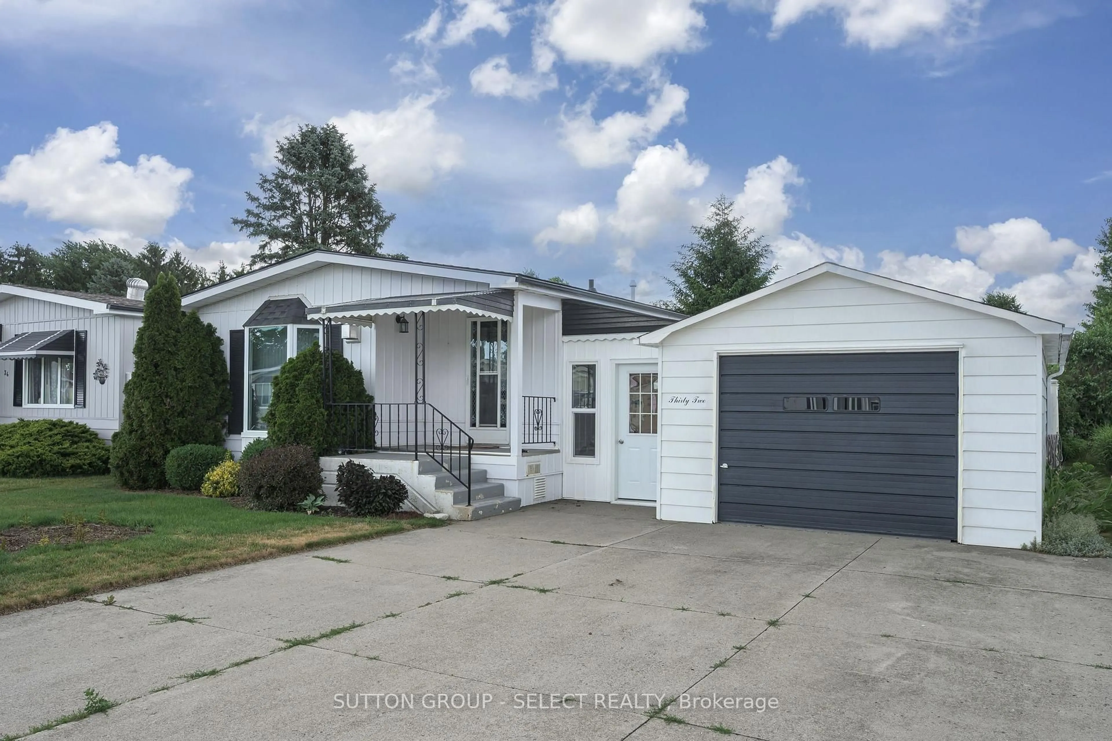 Home with vinyl exterior material, street for 32 Miller St, Strathroy-Caradoc Ontario N7G 3K8