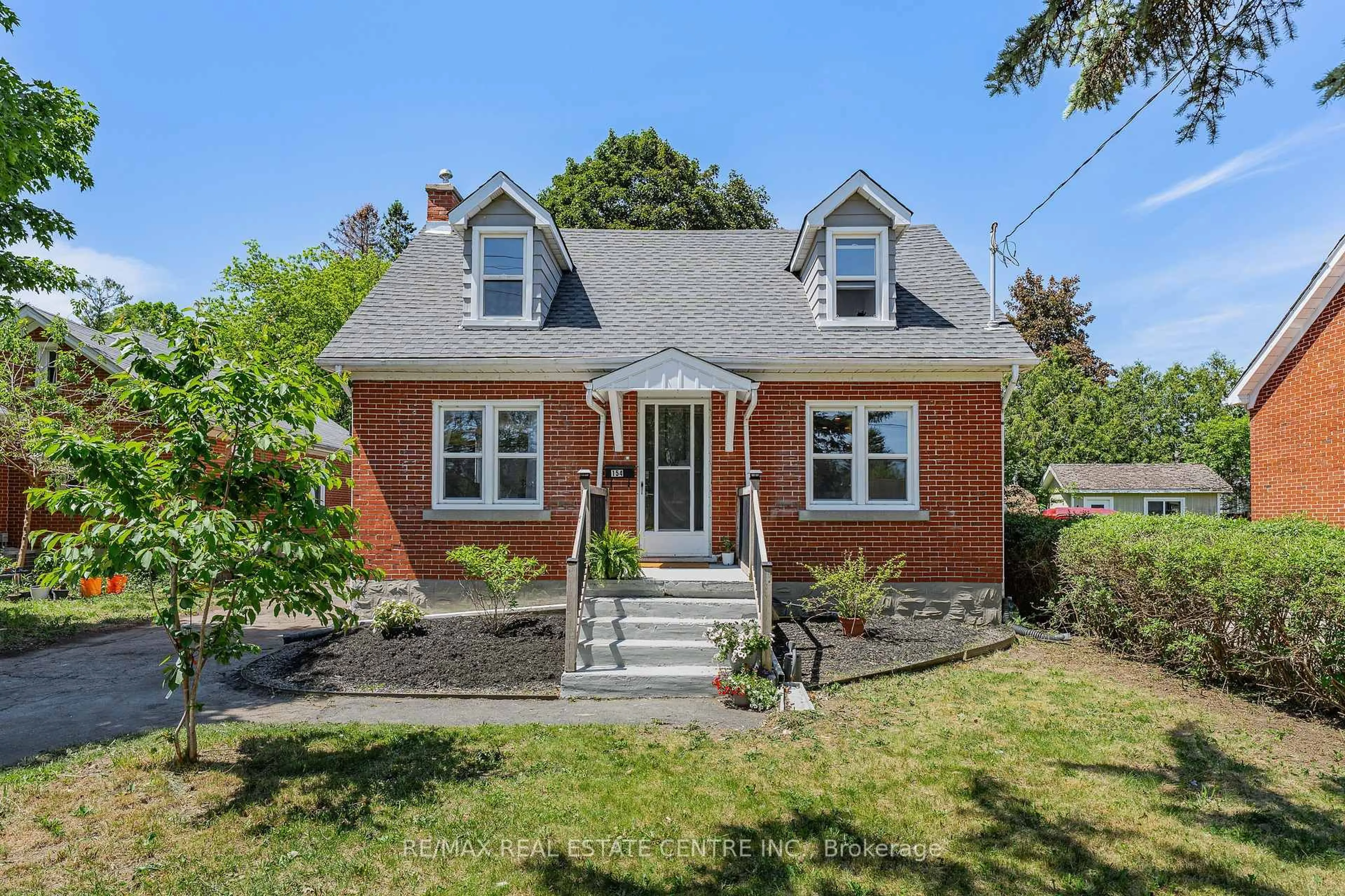 Home with brick exterior material, street for 154 Bridgeport Rd, Waterloo Ontario N2J 2K4