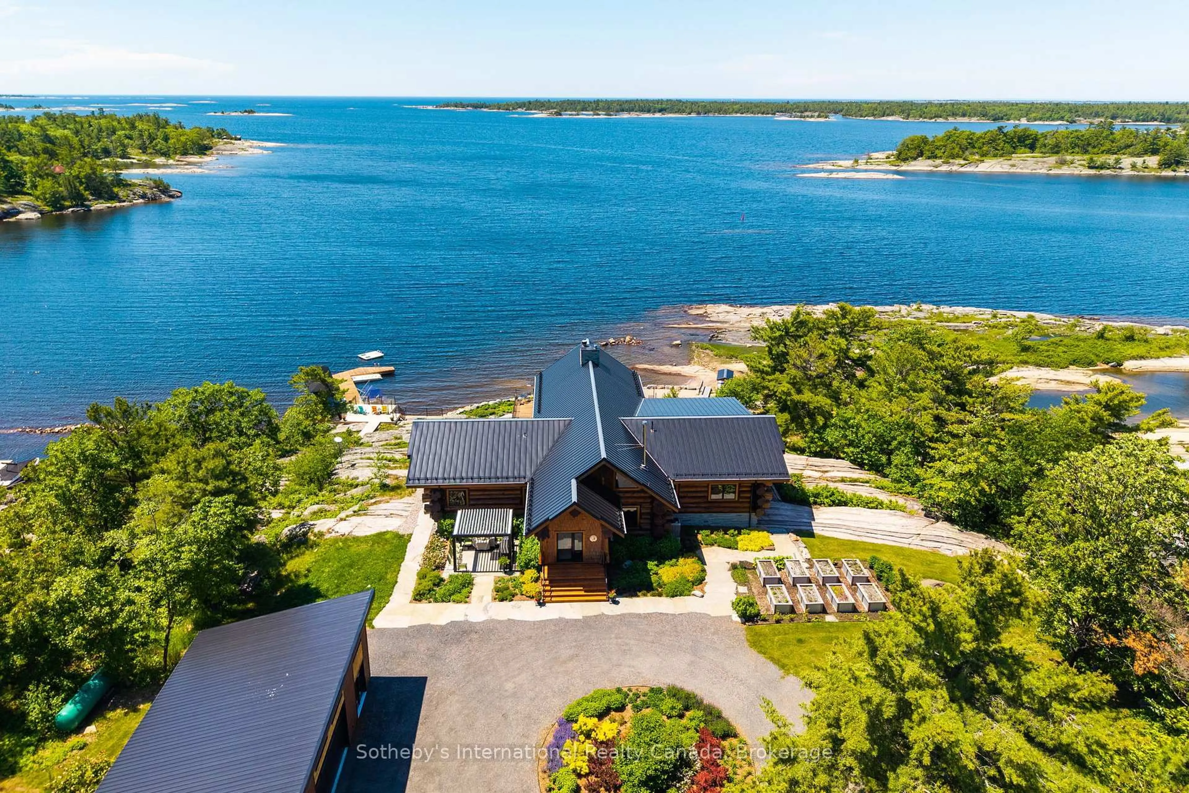 A pic from outside/outdoor area/front of a property/back of a property/a pic from drone, water/lake/river/ocean view for 54 Ireland Point Rd, Carling Ontario P0G 1G0