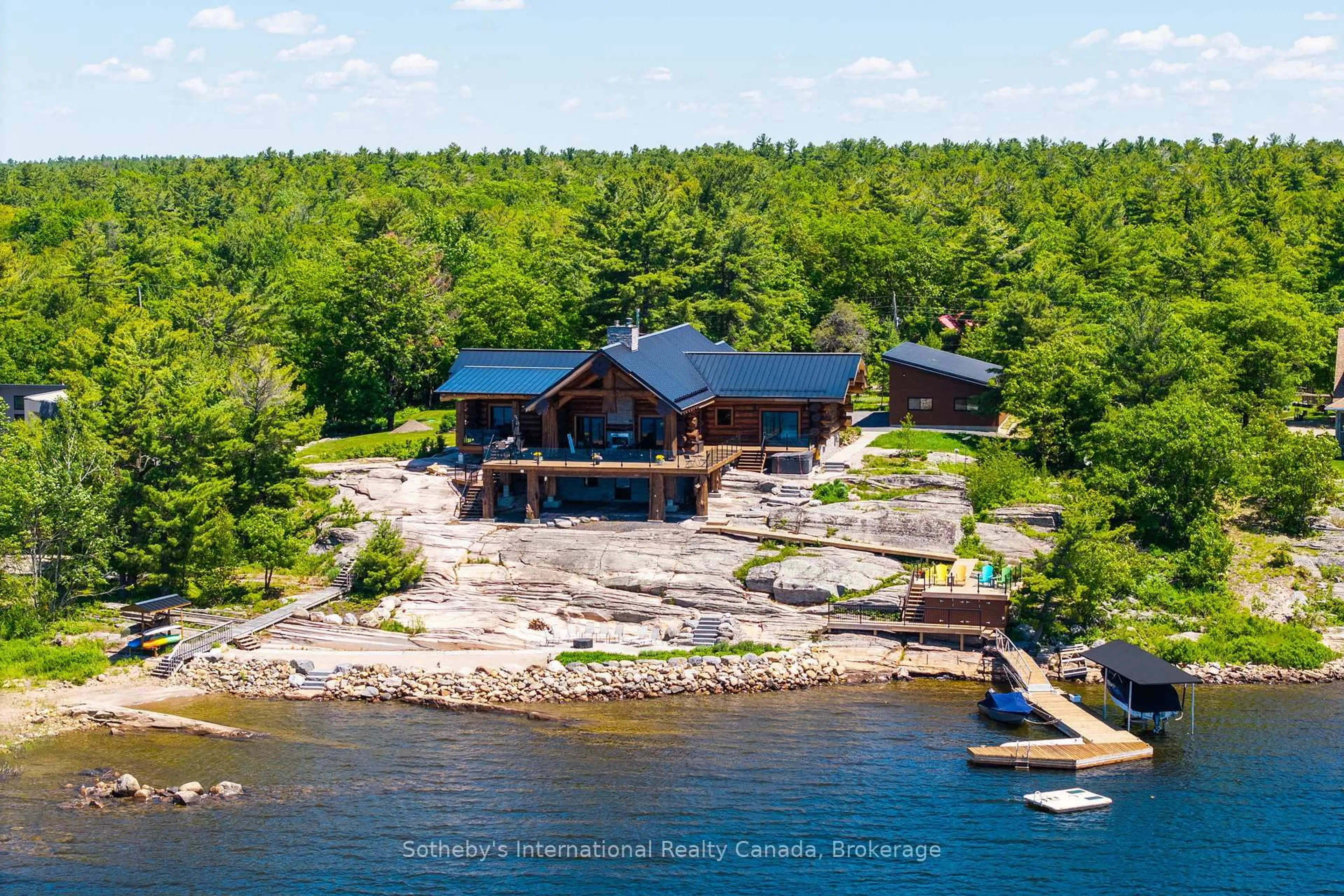 A pic from outside/outdoor area/front of a property/back of a property/a pic from drone, water/lake/river/ocean view for 54 Ireland Point Rd, Carling Ontario P0G 1G0