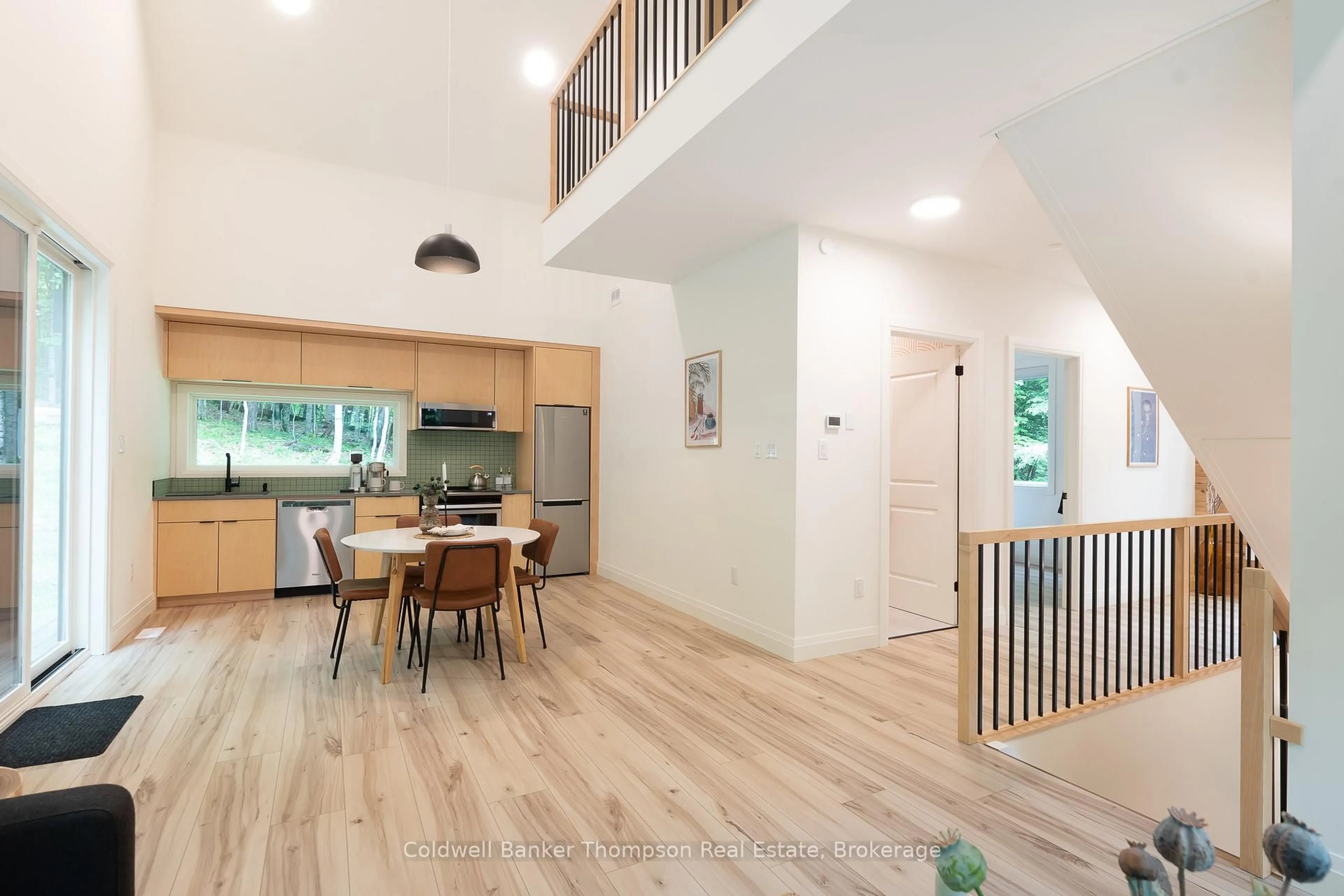 Open concept kitchen, wood/laminate floor for 84 Vernon Lane, Huntsville Ontario P1H 2J2