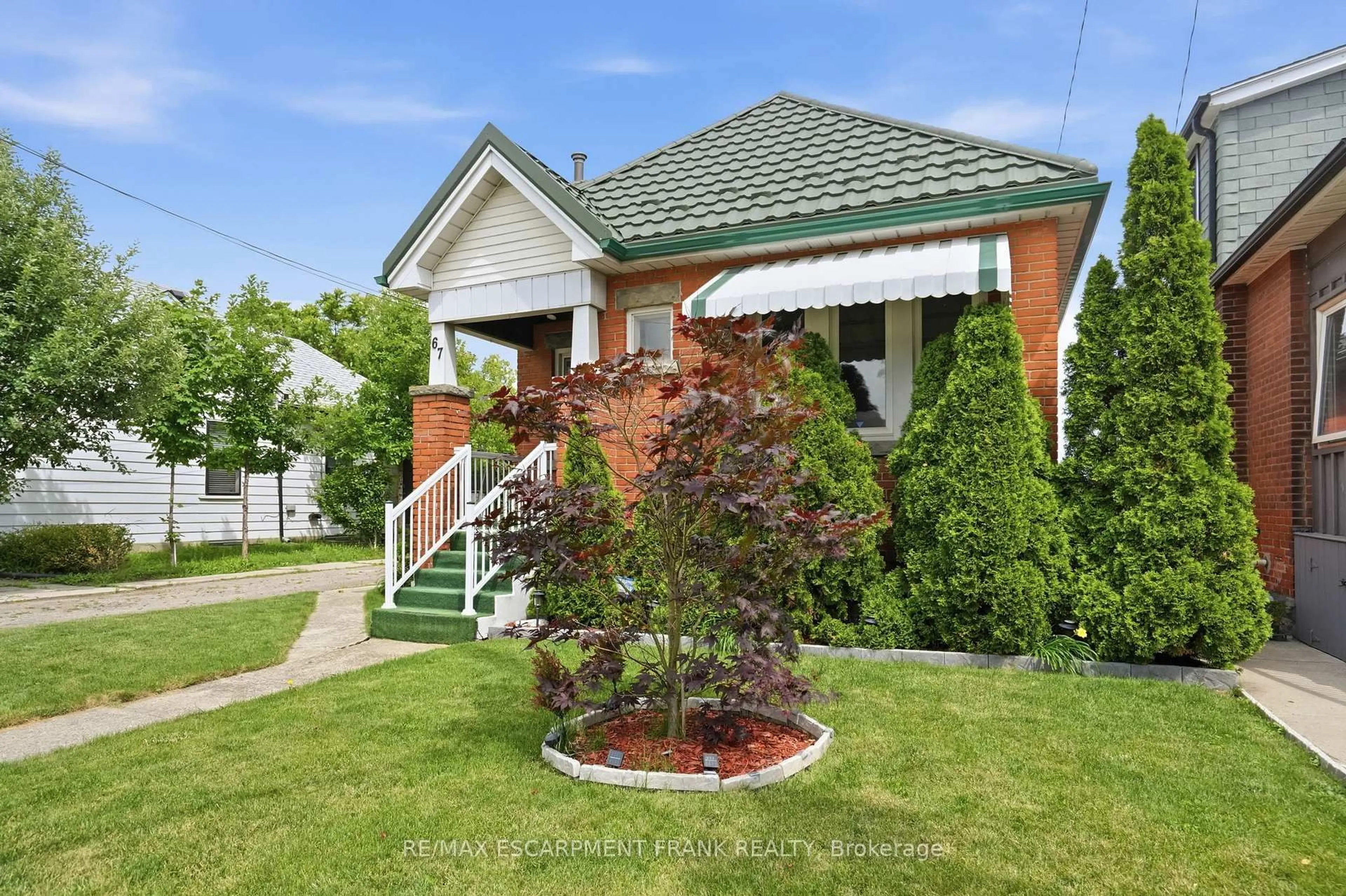 Home with brick exterior material, street for 67 Paradise Rd, Hamilton Ontario L8S 1S3