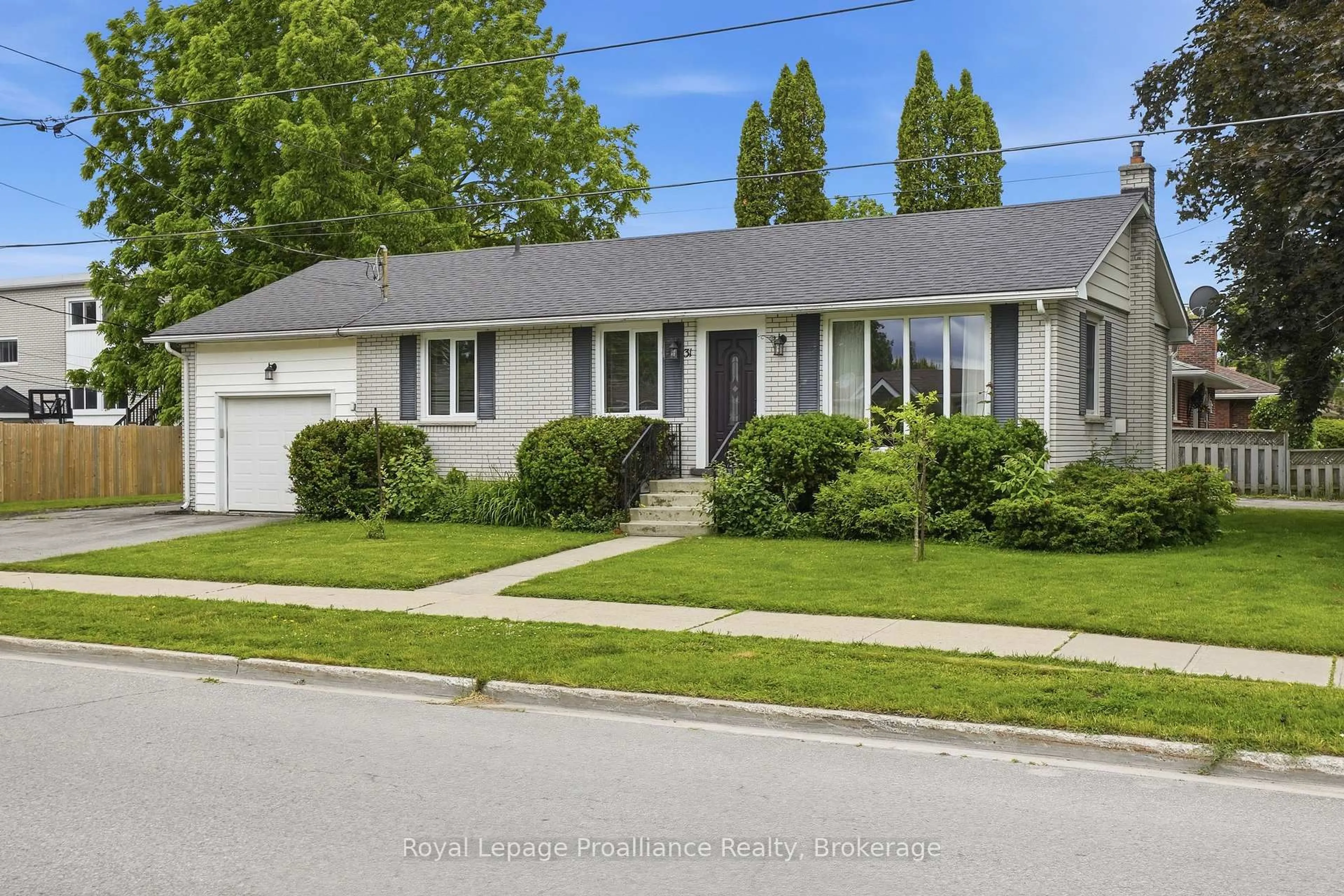 Home with vinyl exterior material, street for 31 Downes Ave, Prince Edward County Ontario K0K 2T0