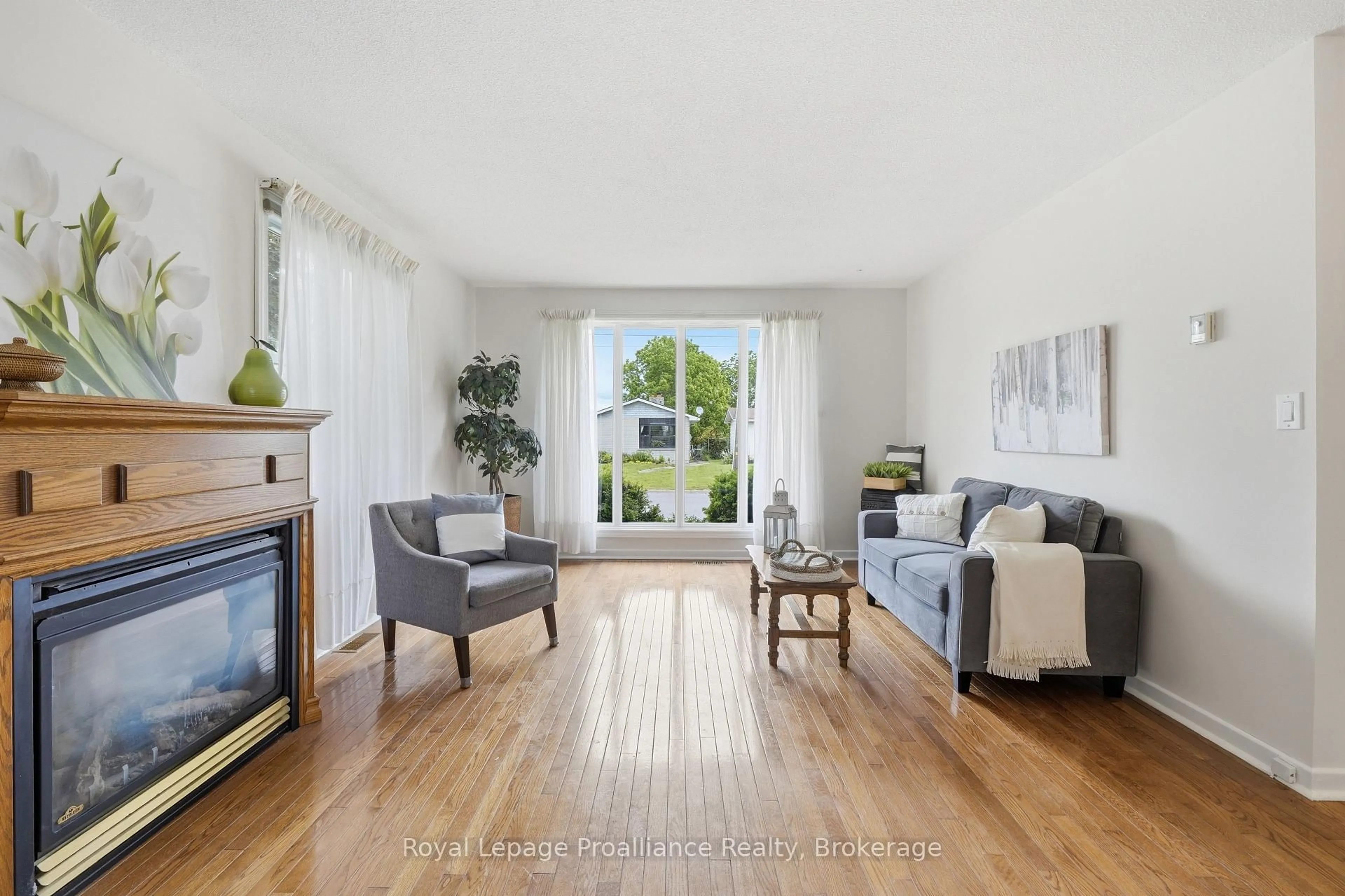 Living room with furniture, wood/laminate floor for 31 Downes Ave, Prince Edward County Ontario K0K 2T0